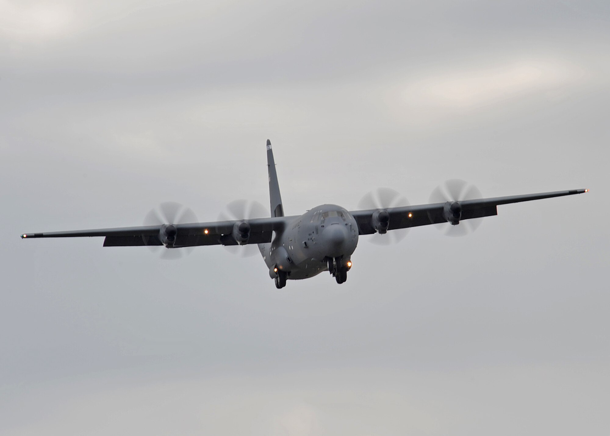A Lockheed Martin C-130J Super Hercules drops its wheels in preparation for a touch-n-go on the flightline, Ramstein Air Base, Germany, June 21, 2010. The C-130J is the newest model in the Hercules family which has the longest continuous production run of any military aircraft in history, serving for more than 50 years. (U.S. Air Force photo by Senior Airman Tony R. Ritter)