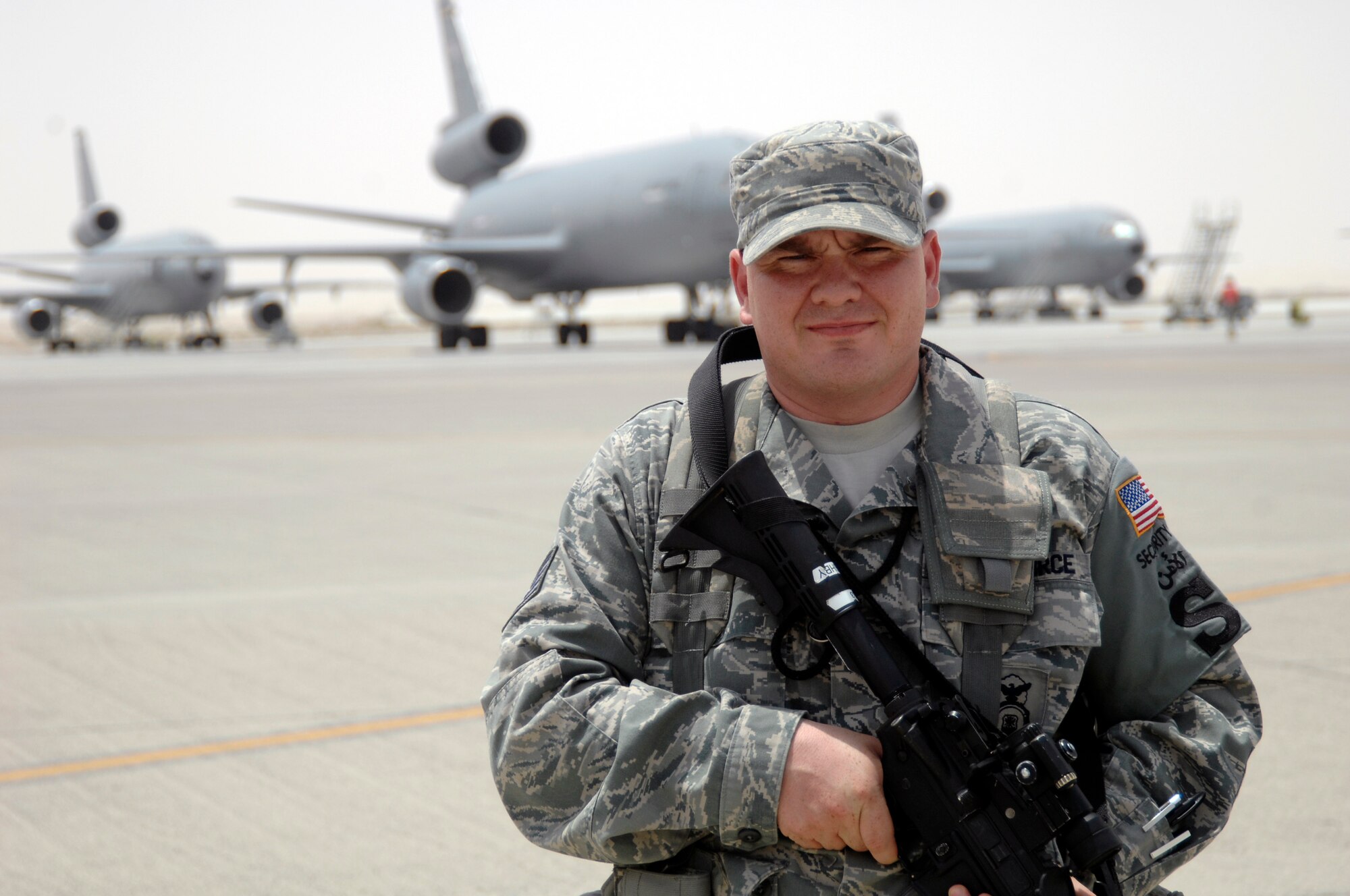 Staff Sgt. Frederick Bushby, security forces craftsman with the 380th Expeditionary Security Forces Squadron, watches the flightline in the 380th Air Expeditionary Wing operations area at a nondisclosed base in Southwest Asia on June 21, 2010. Sergeant Bushby is deployed from the 42nd Security Forces Squadron at Maxwell Air Force Base, Ala., and his hometown is Waterloo Iowa. (U.S. Air Force Photo/Staff Sgt. Jeremy Larlee/released)