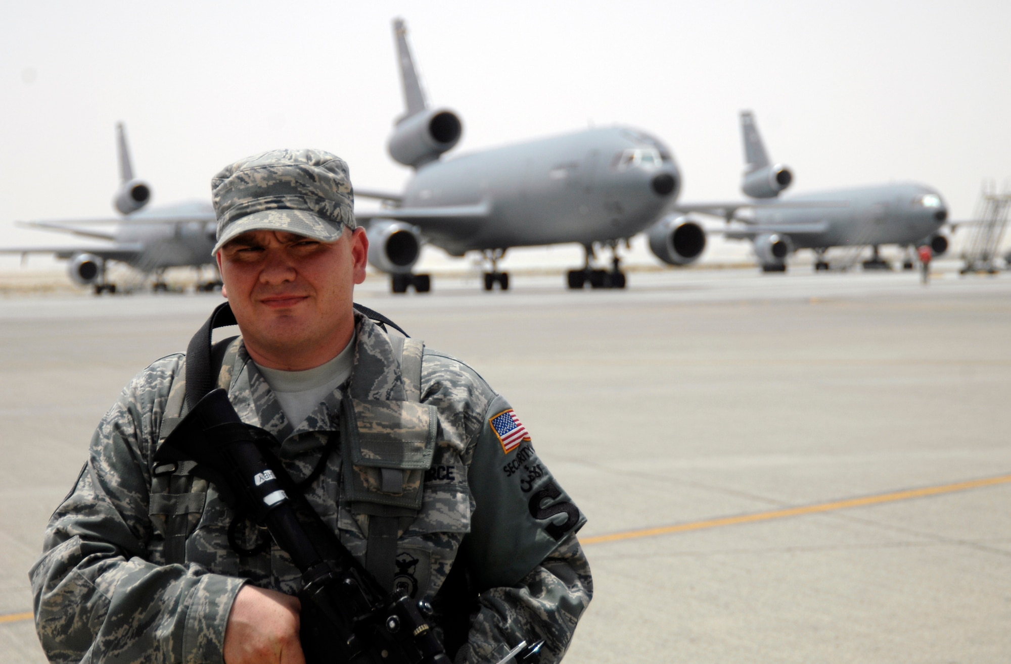 Staff Sgt. Frederick Bushby, security forces craftsman with the 380th Expeditionary Security Forces Squadron, watches the flightline in the 380th Air Expeditionary Wing operations area at a nondisclosed base in Southwest Asia on June 21, 2010. Sergeant Bushby is deployed from the 42nd Security Forces Squadron at Maxwell Air Force Base, Ala., and his hometown is Waterloo Iowa. (U.S. Air Force Photo/Staff Sgt. Jeremy Larlee/released)