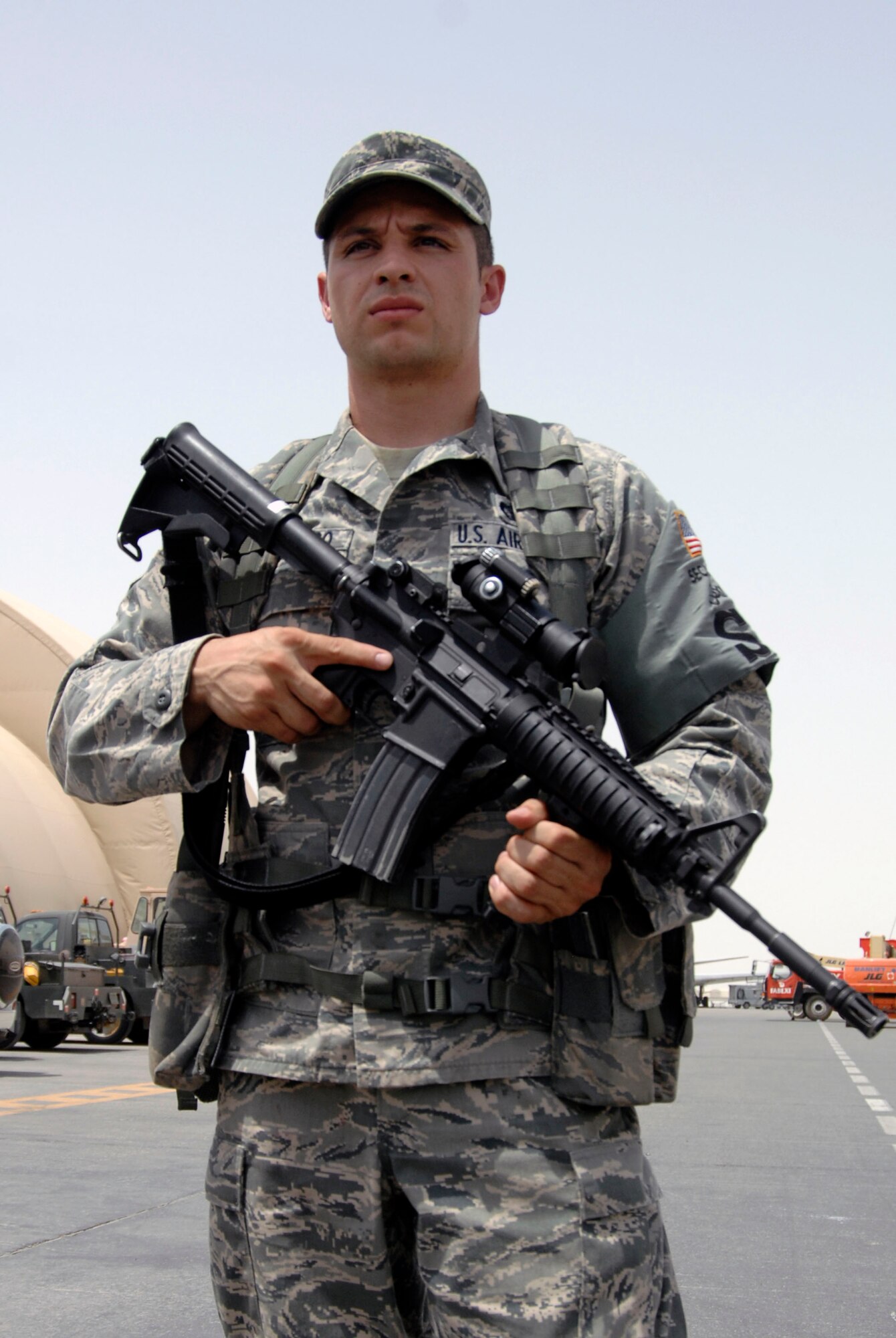 Airman 1st Class Daniel Santiago, security forces journeyman with the 380th Expeditionary Security Forces Squadron, watches a checkpoint in the 380th Air Expeditionary Wing operations area at a nondisclosed base in Southwest Asia on June 21, 2010. Airman Santiago is deployed from the 27th Special Operations Security Forces Squadron at Cannon Air Force Base, N.M., and his hometown is Vallejo, Calif. (U.S. Air Force Photo/Staff Sgt. Jeremy Larlee/released)