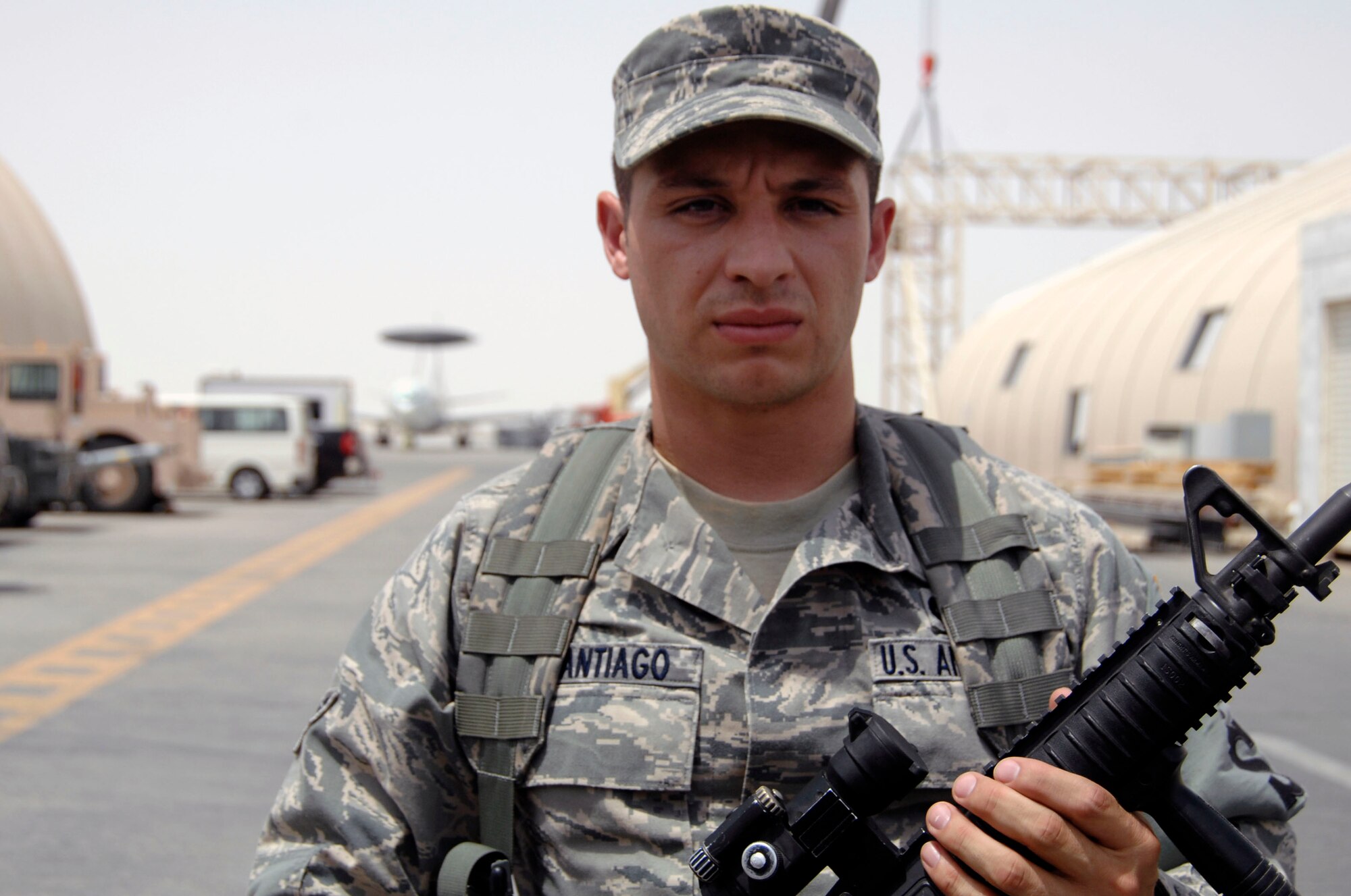 Airman 1st Class Daniel Santiago, security forces journeyman with the 380th Expeditionary Security Forces Squadron, watches a checkpoint in the 380th Air Expeditionary Wing operations area at a nondisclosed base in Southwest Asia on June 21, 2010. Airman Santiago is deployed from the 27th Special Operations Security Forces Squadron at Cannon Air Force Base, N.M., and his hometown is Vallejo, Calif. (U.S. Air Force Photo/Staff Sgt. Jeremy Larlee/released)