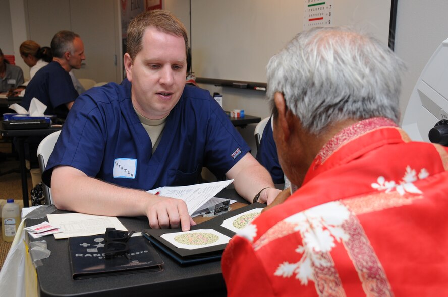Tech. Sgt. Patrick Price, a optometry technician with the 193rd Special Operations Wing's Medical Group out of Middletown, Pa., gives a patient the Randot Stereo Test. The Randot Stereo Test helps test depth perception. Price and other members of the 193rd Medical Group provided free health screenings atthe Hawaii County Office of Aging in Hilo, Hawaii, on June 14th, 2010. Members of the 193rd Medical Group are in Hilo for Medical Innovative Readiness Training.