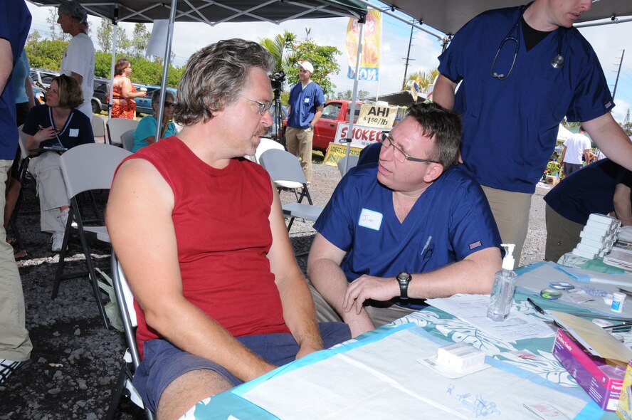 Maj. Jim Manganaro, a physican assistant with the 171st Air Refueling Wing out of Pittsburgh, Pa., talks with a patient. Manganaro joined members of the 193rd Special Operations Wing's Medical Group to provide free health screenings at Maku'u Farmer's Market in Pahoa, Hawaii, on June 13th, 2010. Members of the 193rd Medical Group are in Hilo, Hawaii, for Medical Innovative Readiness Training, with the help of a few members of the 171st Air Refueling Wing from Pittsburgh, Pa.