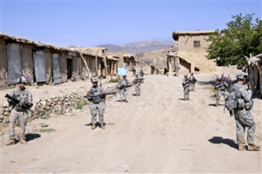 U.S. Army soldiers walk through a bazaar while patrolling the area surrounding Forward Operating Base Baylough in Zabul province, Afghanistan, June 18, 2010. The soldiers are assigned to Company D, 1st Battalion, 4th Infantry Regiment, U.S. Army Europe.