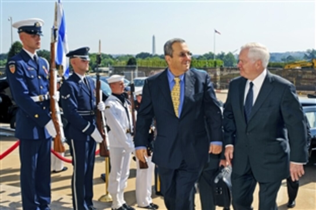U.S. Defense Secretary Robert M. Gates, right, escorts Israeli Defense Minister Ehud Barak into the Pentagon, June 21, 2010, for security discussions.