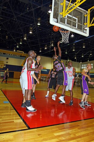 Drevonn Fluellen, of Fil-Am, puts up a layup during the championship game of the Intramural Basketball season at the IronWorks Gym here June 21. Fluellen put Fil-Am in the lead for the first time during the second half.