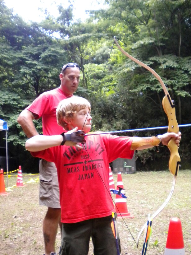 Tenderfoot David Rasmussen, 11, practices archery during Troop 77’s 2010 one-week summer camp in Camp Tama, Yokota, Japan.