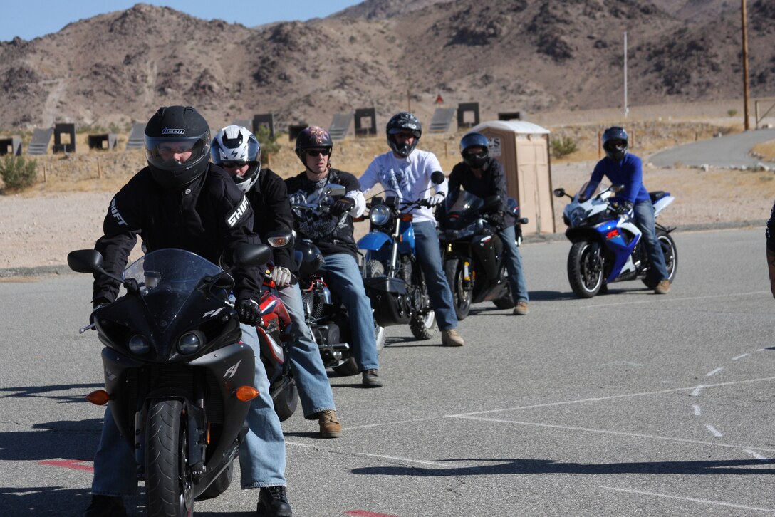 Riders during the Basic Riders Course prepare to perform an exercise at a closed course near Combat Center Rifle Range June 22. This is the first of two courses riders are required to take.