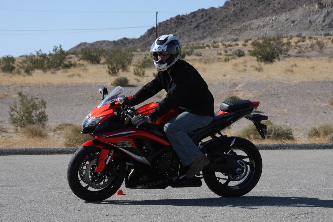 A rider in the Basic Riders Course performs an exercise drill during the Basic Riders Course next to the Combat Center Rifle Range Tuesday.  The course is designed for both riders of cruiser and sport bikes.