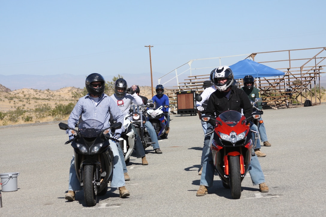 Riders during the Basic Riders Course prepare to perform an exercise next to the Combat Center Rifle Range Tuesday.  This is the first of two courses the riders are required to take.