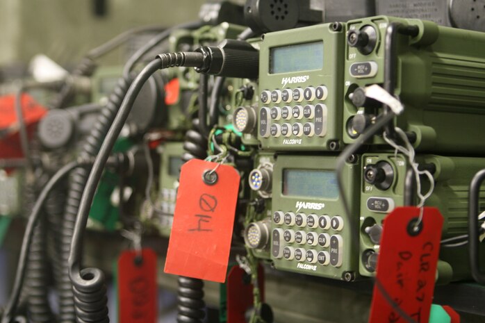Radios being used by Communication Company, Combat Logistics Regiment 27, 2nd Marine Logistics Group, sit in order on top of a table in the command post waiting for incoming calls during Operation Paratus aboard Camp Lejeune, N.C., June 22, 2010.  Marines with Comm. Co. took part in the two-week field exercise in order to reacquaint themselves with their equipment.