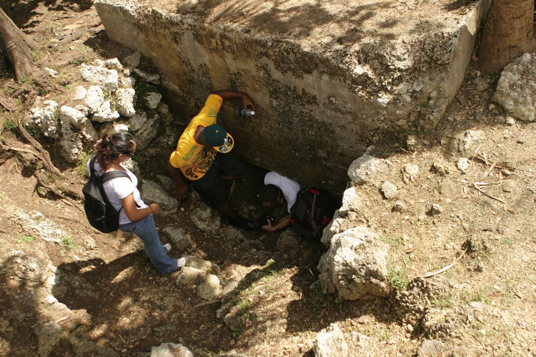 Marines explore a bunker used by the Japanese Army during the Battle of Okinawa tour hosted by Marine Corps Community Services, June 22, at Taladai Park, Ginowan, Okinawa.