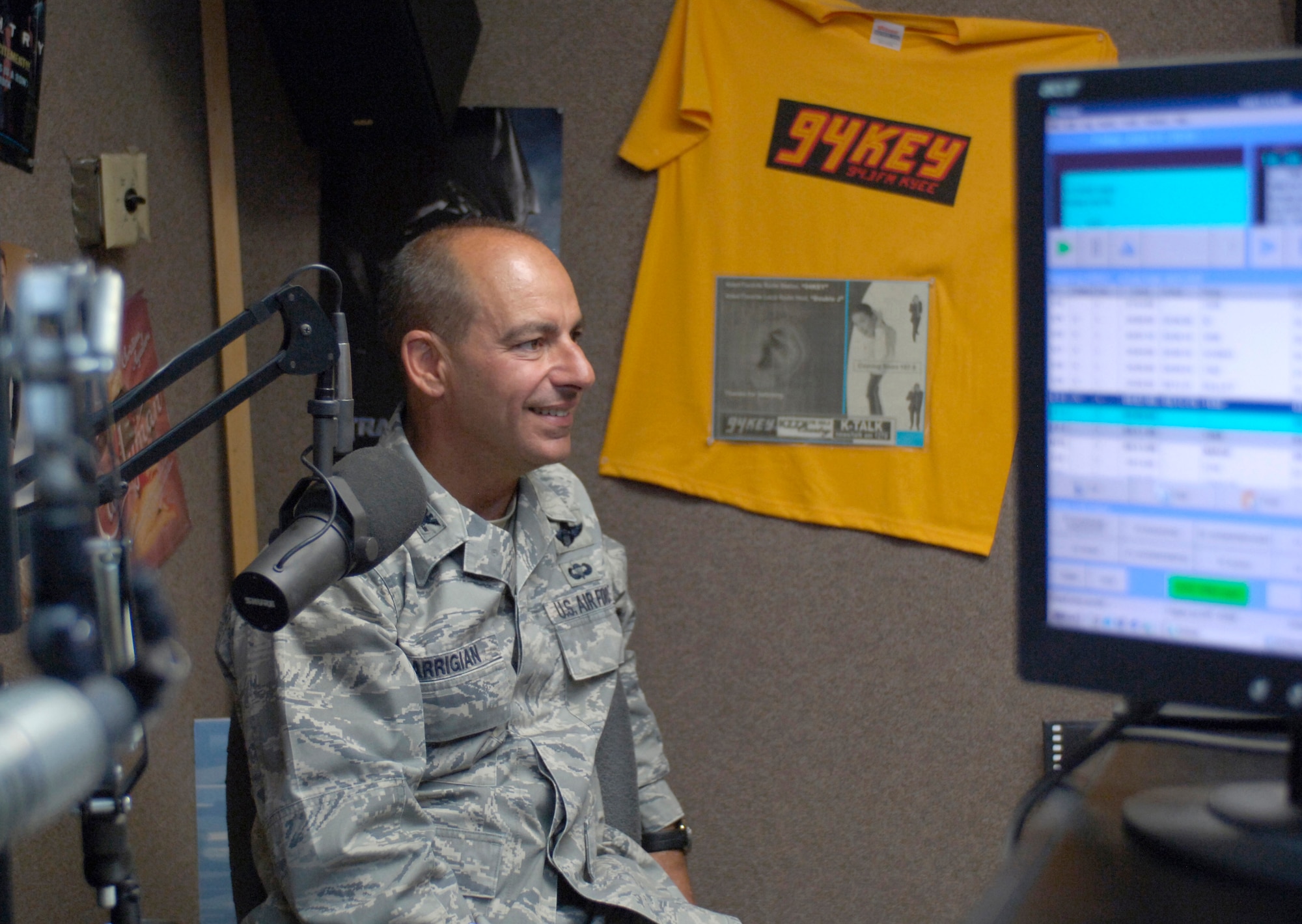 HOLLOMAN AIR FORCE BASE, N.M. -- Col. Jeff Harrigian, 49th Fighter Wing commander, prepares to take part in his last "Commander's Corner" at 94 KYEE-FM June 11, 2010. This was the last show for both Colonel Harrigian and radio personality Double J (James White). The radio show is a monthly event hosted by the commander and provides listeners with updates on what is taking place at Holloman. (U.S. Air Force photo by mr. Arlan Ponder / Released)