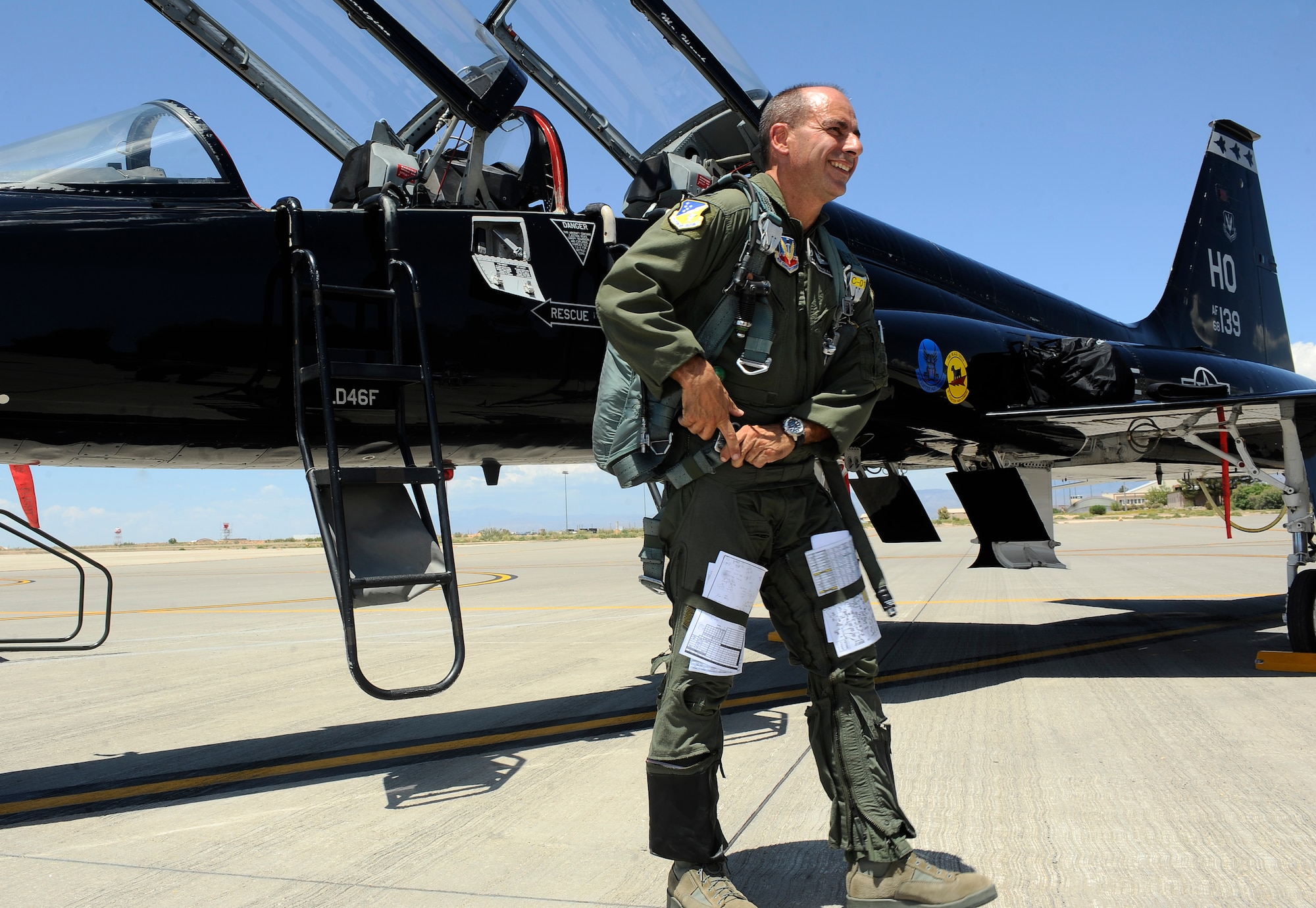HOLLOMAN AIR FORCE BASE, N.M. -- Col. Jeff Harrigian removes his flight equipment after his final flight in a T-38 Talon aircraft as the 49th Fighter Wing commander, June 21, 2010. Colonel Harrigian is an Air Force Academy graduate who assumed command of the 49th FW in January 2008. (U.S. Air Force photo by Senior Airman Veronica Stamps / Released)