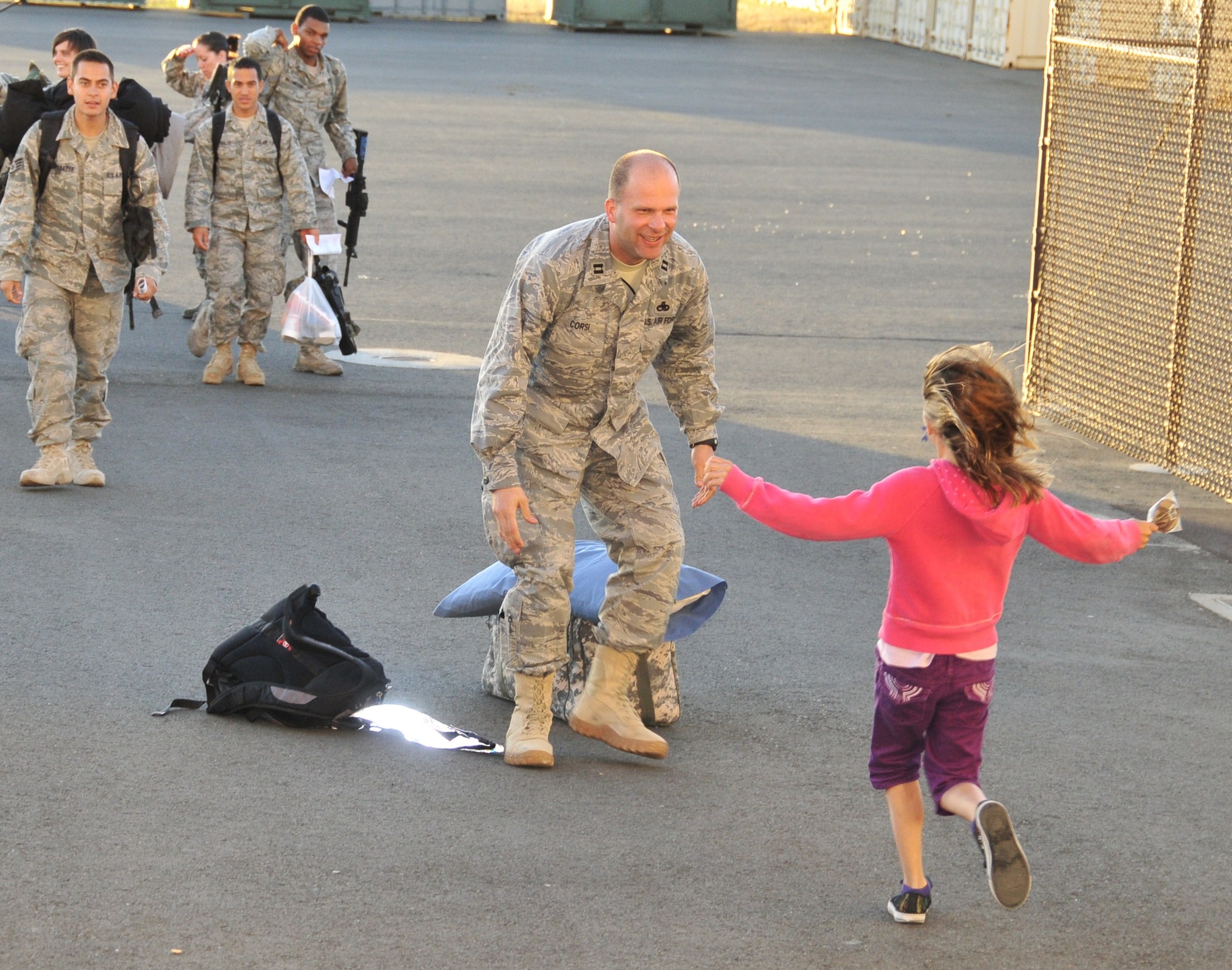 Capt. Robert Corsi, 573rd Global Mobitily Squadron is welcomed home by his daughter after supporting Operation Enduring Freedom. The 615th Contingency Response Wing welcomed home its Airmen from deployment in Afghanistan. Hundreds of Team Travis leadership were on hand to greet the Airmen. In early February, more than 100 Airmen deployed to forward-operating base Mazar-i-Sharif in northern Afghanistan to establish airfield operations in support of Operation Enduring Freedom.(U.S. Air Force photo/ Capt. Paradon Silpasornprasit)