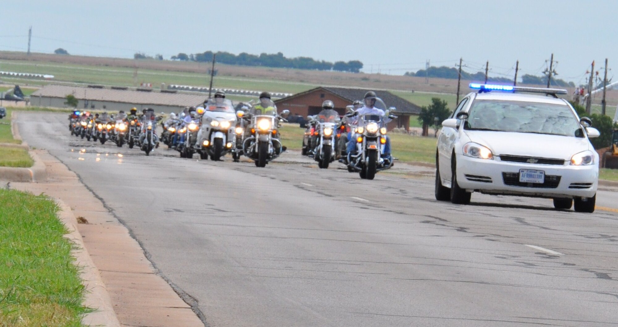 Members from Sheppard Air Force Base, Texas, and the Green Knights Motorcycle club rumble through the base during National Motorcycle Ride to Work Day June 21, 2010. Forty motorcyclists escorted by the 82nd Security Forces Squadron, ride the streets to promote motorcycle awareness and safety. (U.S. Air Force Photo/Airman 1st Class Adawn Kelsey)
