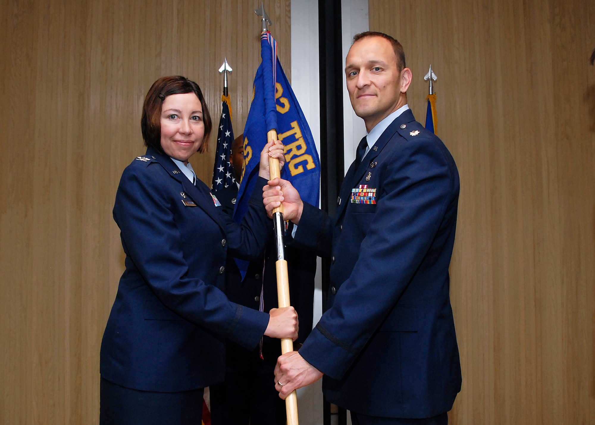 Lt. Col. John Mohatt (right), accepts the squadron guidon for the 882nd Training Support Squadron from Col. Lista Benson (left), 882nd Training Group commander, during a change-of-command ceremony June 18, 2010.  Lt. Col. Kevin Franke, 882nd TRSS commander, relinquished command. (U.S. Air Force Photo/Mike Litteken) 