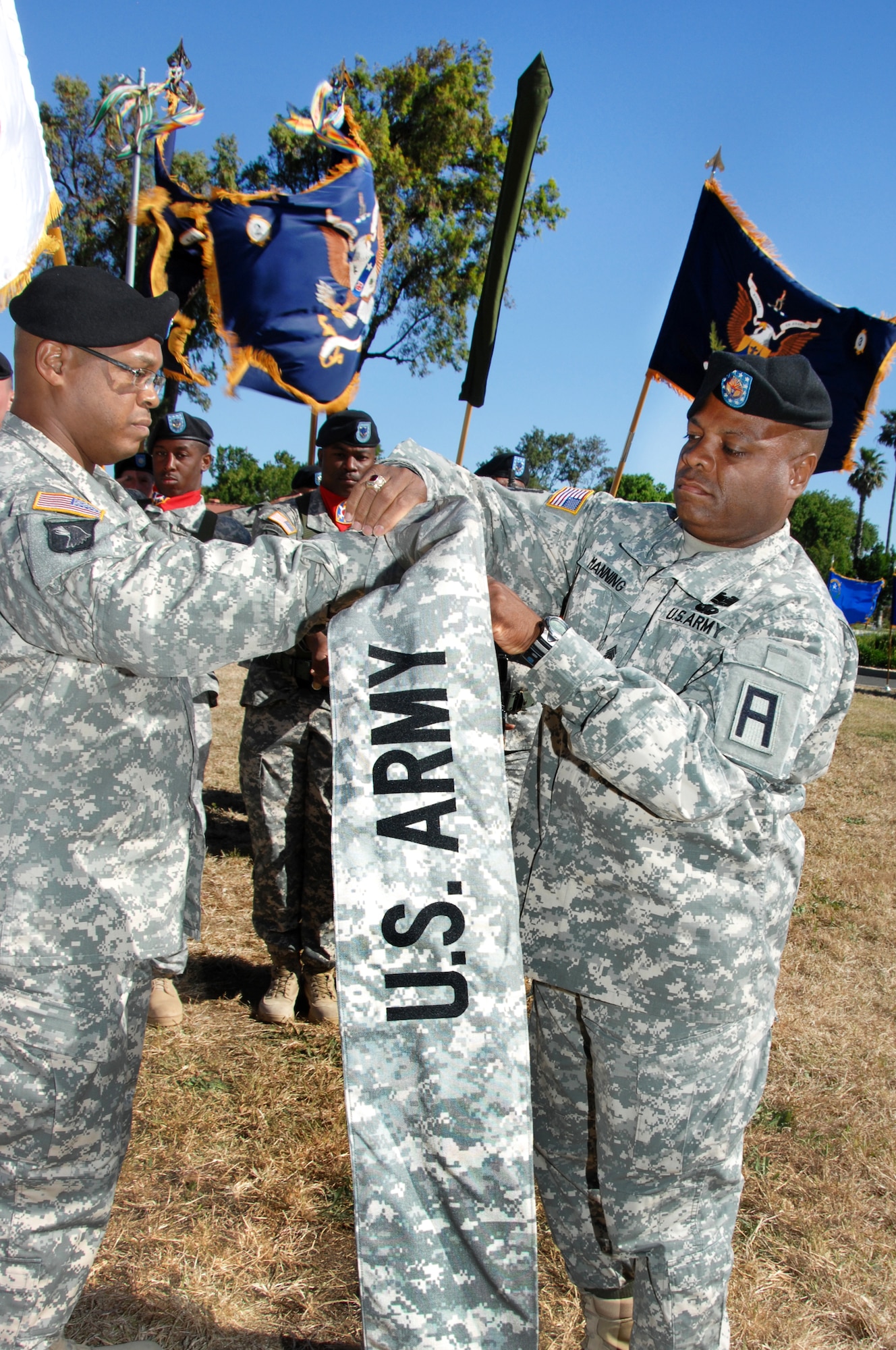 Col. Tracy Smith, 402nd Field Artillery Brigade commander, left, and Command Sergeant Major George Manning case the 402nd FAB colors June 11.  The ceremony signified the brigade’s move to Fort Bliss, Texas, effective Aug. 15, 2010.  (U.S. Air Force photo by Civ/Nan Wylie)