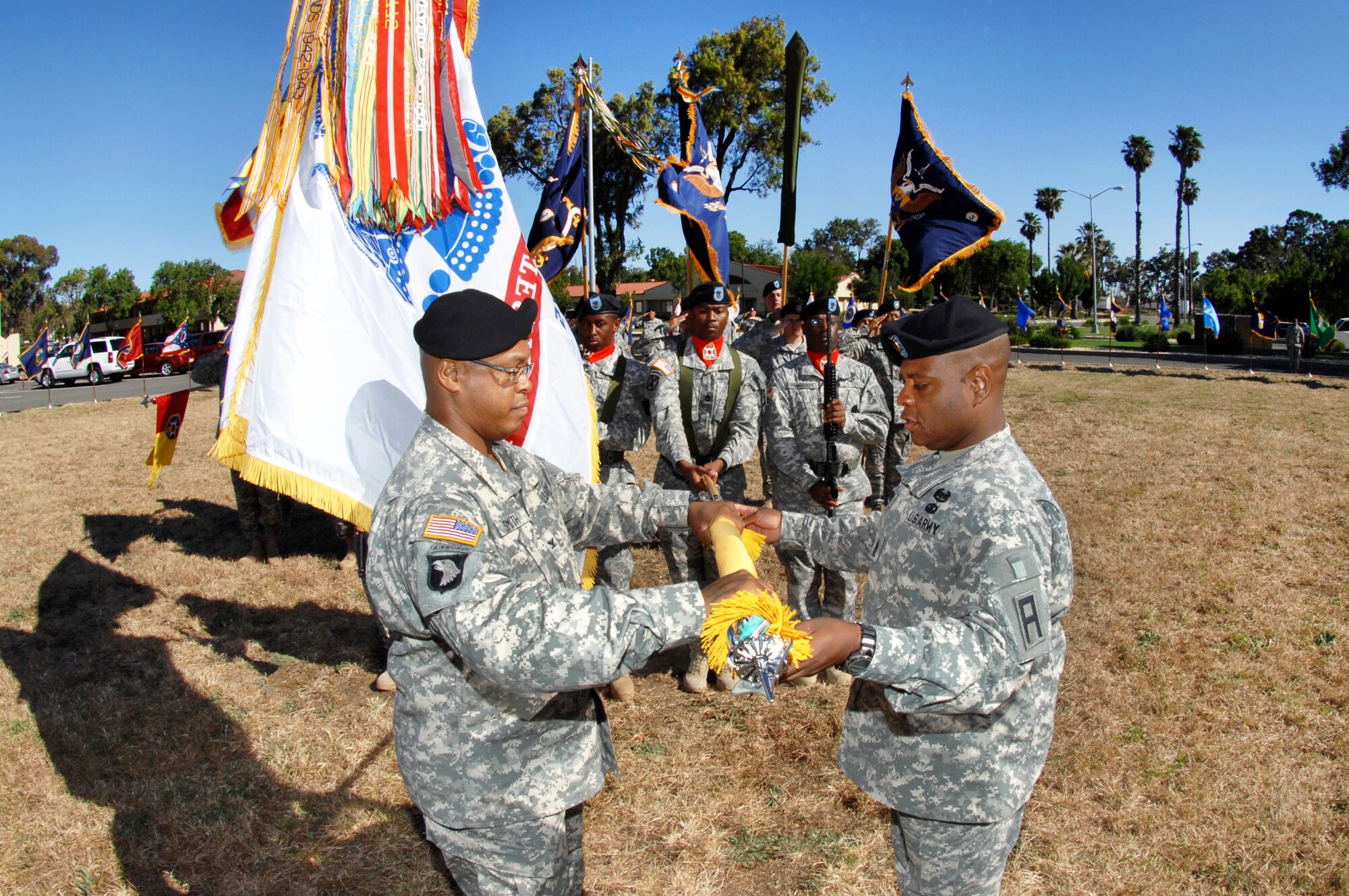 Col. Tracy Smith, 402nd Field Artillery Brigade commander, left, and Command Sergeant Major George Manning case the 402nd FAB colors June 11.  The ceremony signified the brigade’s move to Fort Bliss, Texas, effective Aug. 15, 2010.  (U.S. Air Force photo by Civ/Nan Wylie)