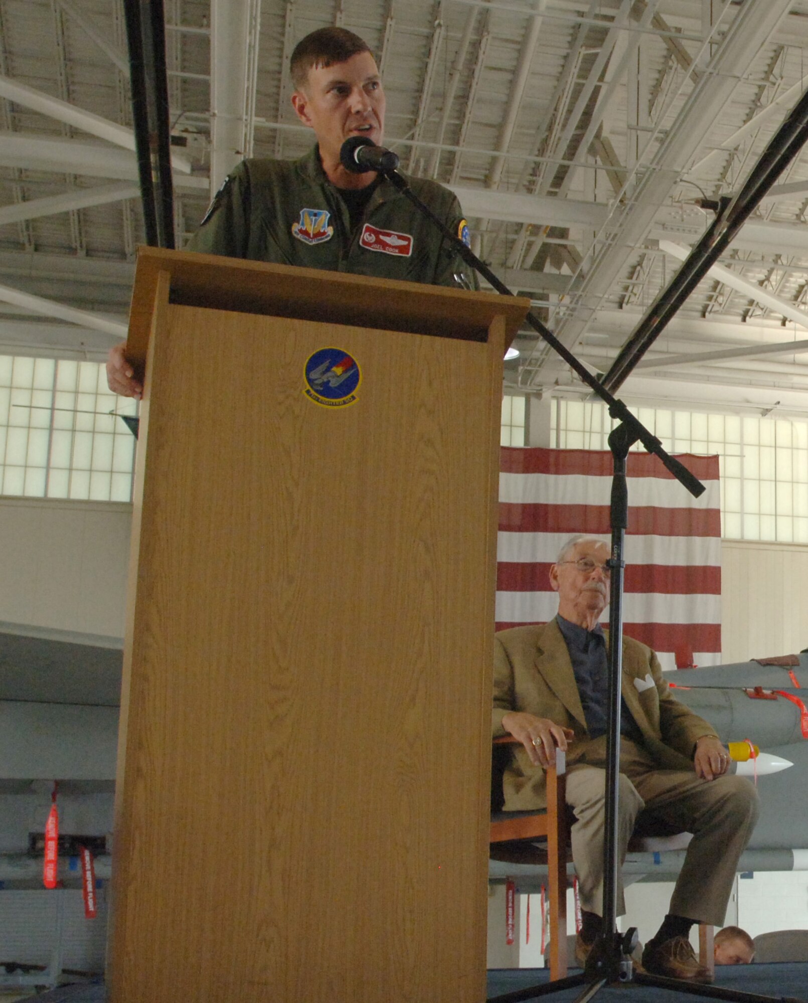 LANGLEY AIR FORCE BASE, Va. -- Lt. Col. Joel Cook, 71st Fighter Squadron  commander, addresses the audience at the 71 FS open house in the squadron hangar June 18. The festivities included awards presentations, free food and visits from distinguished alumni in celebration of the impending squadron inactivation. (U.S. Air Force photo/Airman 1st Class Jason J. Brown)