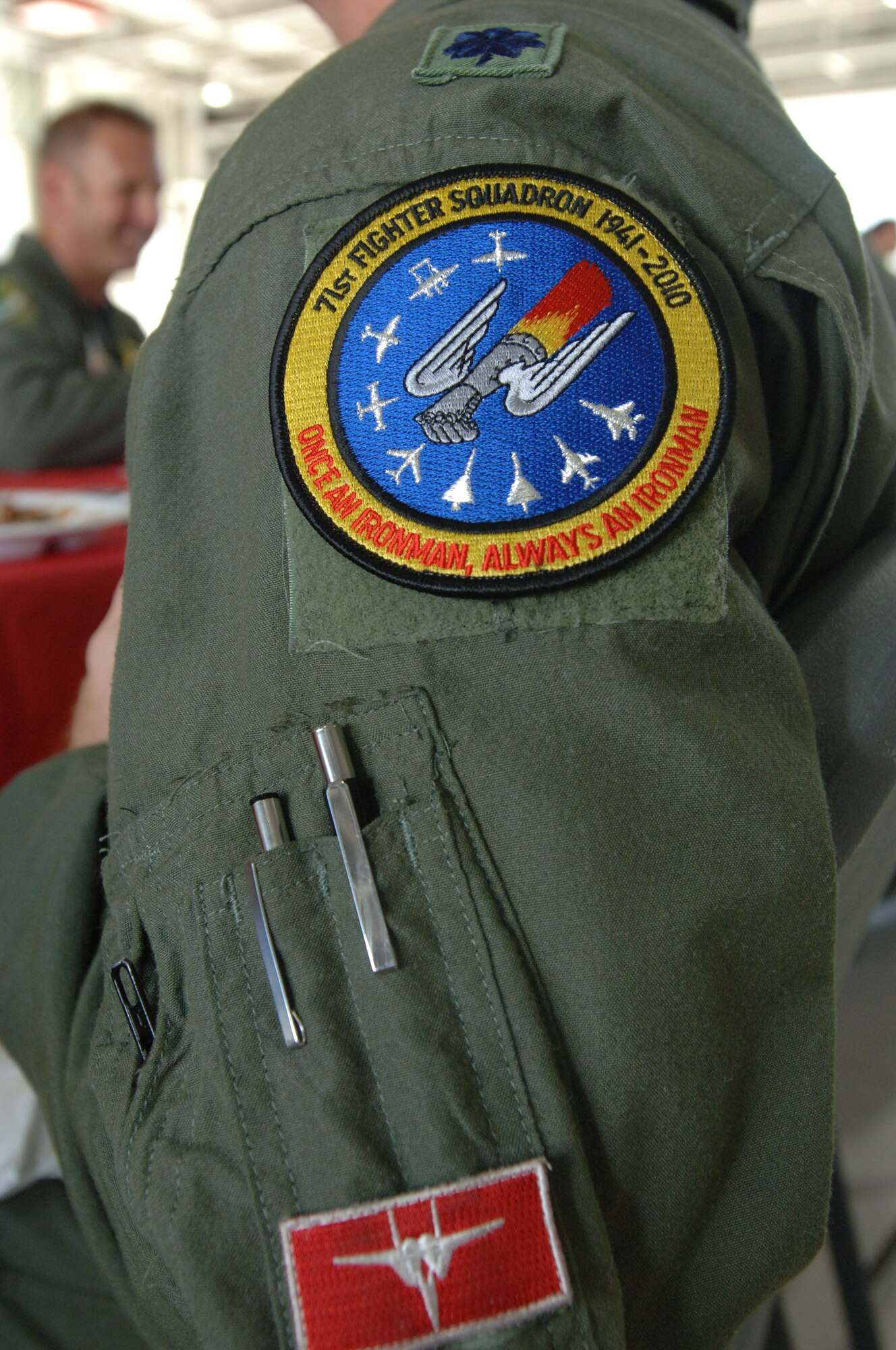 LANGLEY AIR FORCE BASE, Va. -- Lt. Col. Dennis Scarborough, 1st Operations Group, displays a 71st Fighter Squadron memorial unit patch on his flight suit at the 71 FS open house in the squadron hangar June 18. The festivities included awards presentations, free food and visits from distinguished alumni in celebration of the impending squadron inactivation. (U.S. Air Force photo/Airman 1st Class Jason J. Brown)