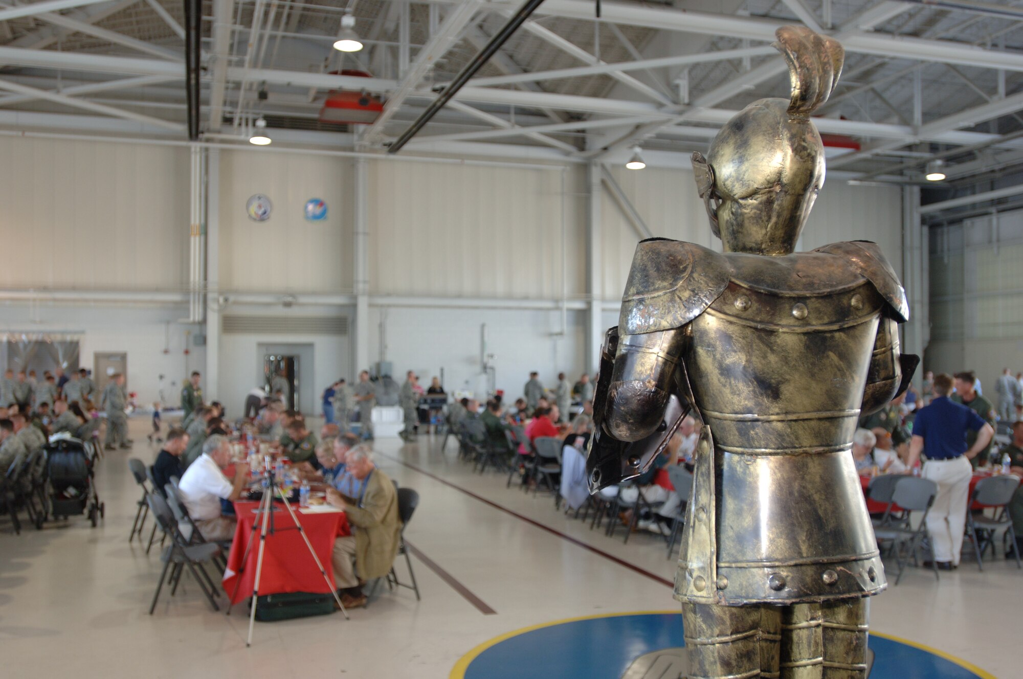 LANGLEY AIR FORCE BASE, Va. -- The iconic “Ironman” suit of armor stands before the crowd of guests at the 71st Fighter Squadron open house in the squadron hangar June 18. The festivities included awards presentations, free food and visits from distinguished alumni in celebration of the impending squadron inactivation. (U.S. Air Force photo/Airman 1st Class Jason J. Brown)