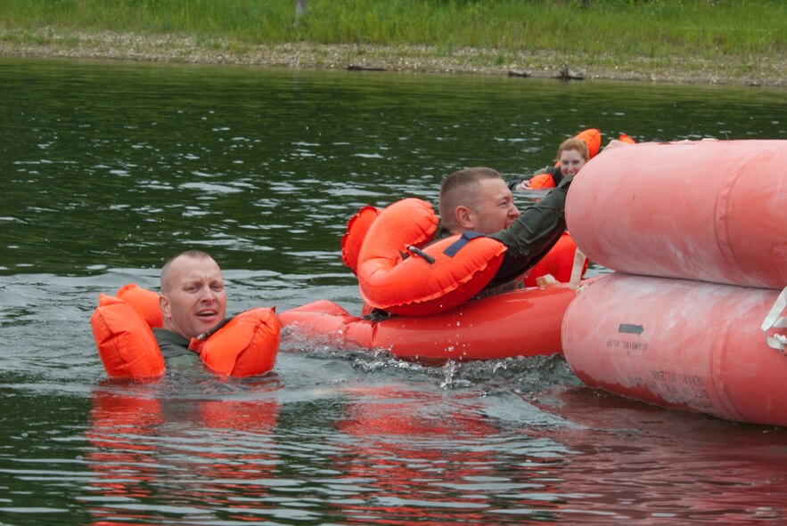 Air crew members periodically practice getting into and out of life rafts as part of survival training with the Minnesota Air National Guard on June 13, 2010 at Bush Lake in Bloomington, Minn. USAF official photo by Master Sgt. Dave Fenner