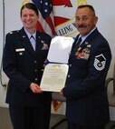 Master Sgt. Timothy Burnett, 940 LRS, received the Air Force commendation medal from Lt. Col. Barbara Manouse during his retirement ceremony June 6.