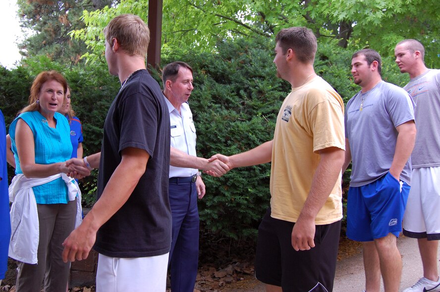 OFFUTT AIR FORCE BASE, NE - Brig. Gen. John N.T. Shanahan, 55th Wing commander, and his wife Laura, greet members of the University of Florida Gators baseball team and welcome them to the base June 20. As the official sponsor of the Gators for the 2010 College World Series, 55th Wing members treated the team to a base tour, a weapons demonstration and barbecue dinner at the Community Center.  U.S. Air Force photo by 1st Lt. Kenneth Scholz 