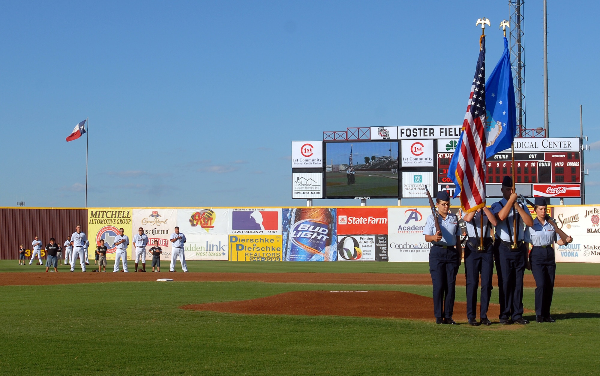 The 17th Training Group Drill and Ceremony Black Rope team post the Colors at the beginning of the San Angelo Colts United League baseball team game against the Rio Grande Valley White Wings June 18.  The Colts held a military appreciation night honoring the men and women of Goodfellow AFB, TX. (U.S. Air Force photo/Master Sgt Randy Mallard)