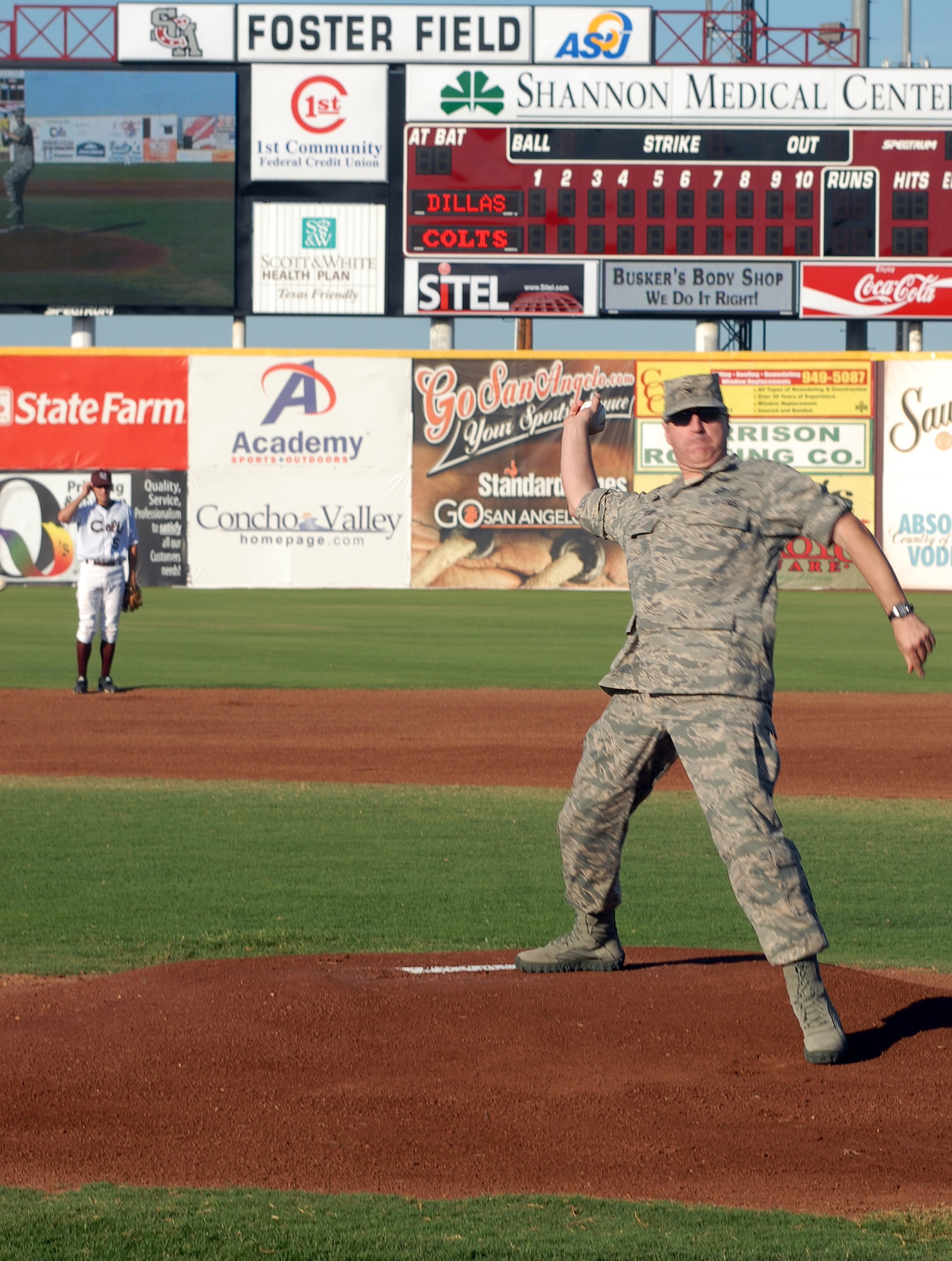 Col. Thomas Geary, 17th Training Wing commander, throws out the first pitch at the beginning of the San Angelo Colts United League baseball team game against the Rio Grande Valley White Wings June 18.  The Colts held a military appreciation night honoring the men and women of Goodfellow AFB, TX. (U.S. Air Force photo/Master Sgt Randy Mallard)