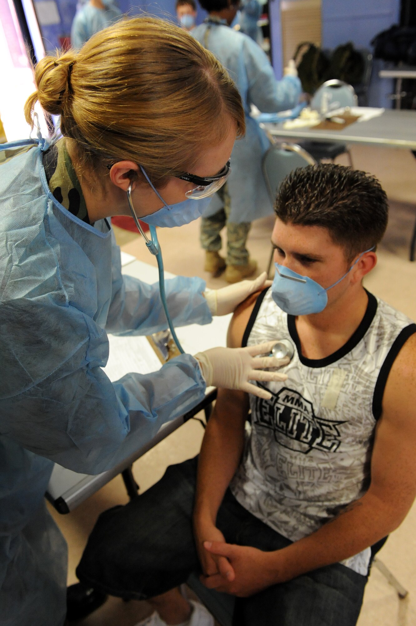 Capt. Marcene McVay, a 19th Medical Group provider, checks June 17 the sound of Senior Airman Ryan Thompson, 19th Force Support Squadron fitness specialist, lungs to ensure there’s no infection during a 19th Medical Group point of dispensing exercise at the Thomas Community Activities Center.  The all-hazards response training lasted four days and included an integrated series of events, tabletop exercises, seminars and functional exercises. (U.S. Air Force photo by Senior Airman Ethan Morgan)