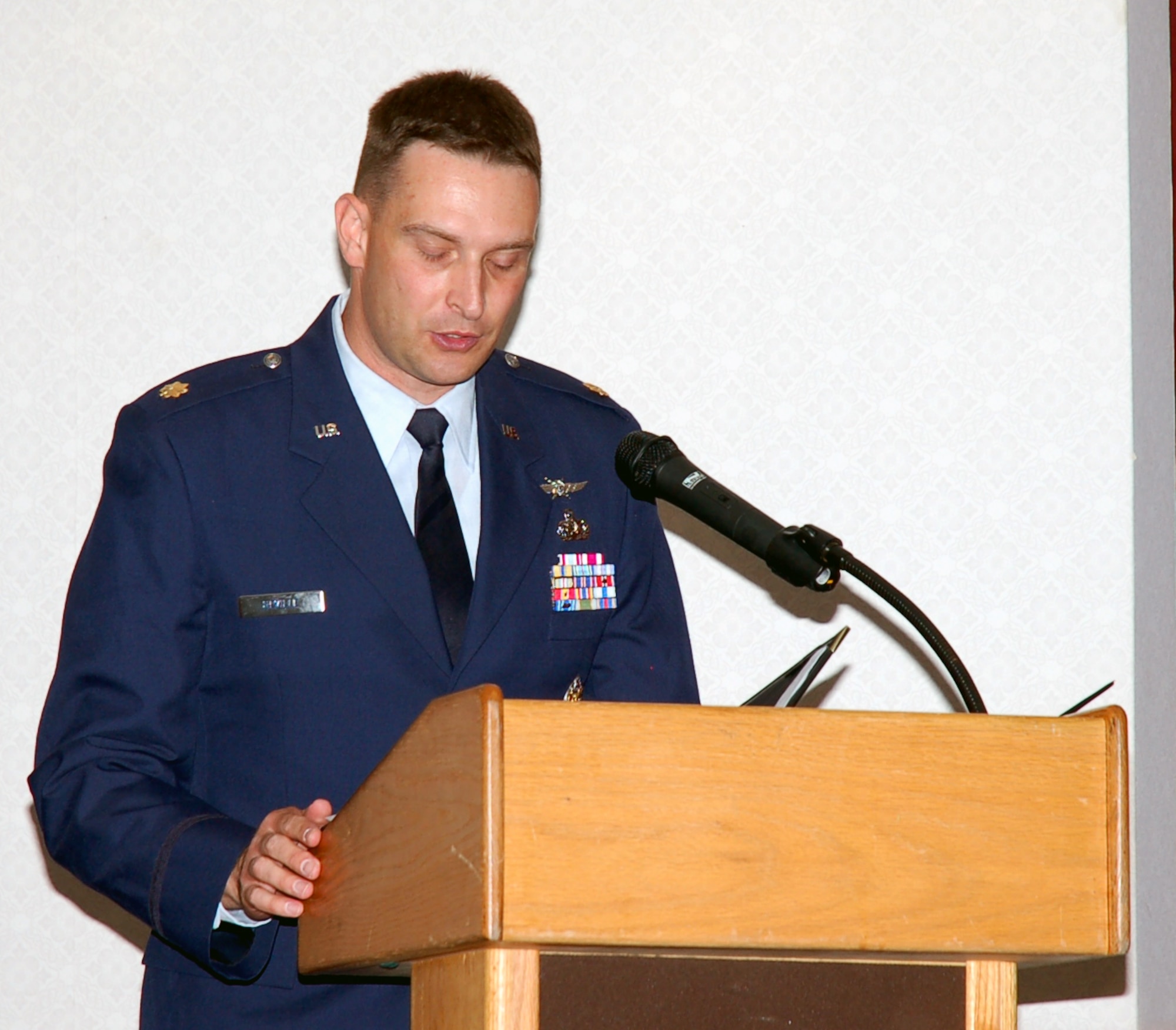BARKSDALE AIR FORCE BASE, La. - Maj. Brett NeVille talks to the 608th Air Communications Squadron after assuming command from Maj. Gen. Floyd Carpenter, Eighth Air Force commander, during a change-of-command ceremony June 18 in the Stripes Club Ballroom at Barksdale Air Force Base, La. Major NeVille is also the Headquarters Eighth Air Force Director of Communications and Information. Major NeVille took command of the 608th ACOMs from Lt. Col. Michael Haddock. (U.S. Air Force photo by Staff Sgt. Brian Stives)