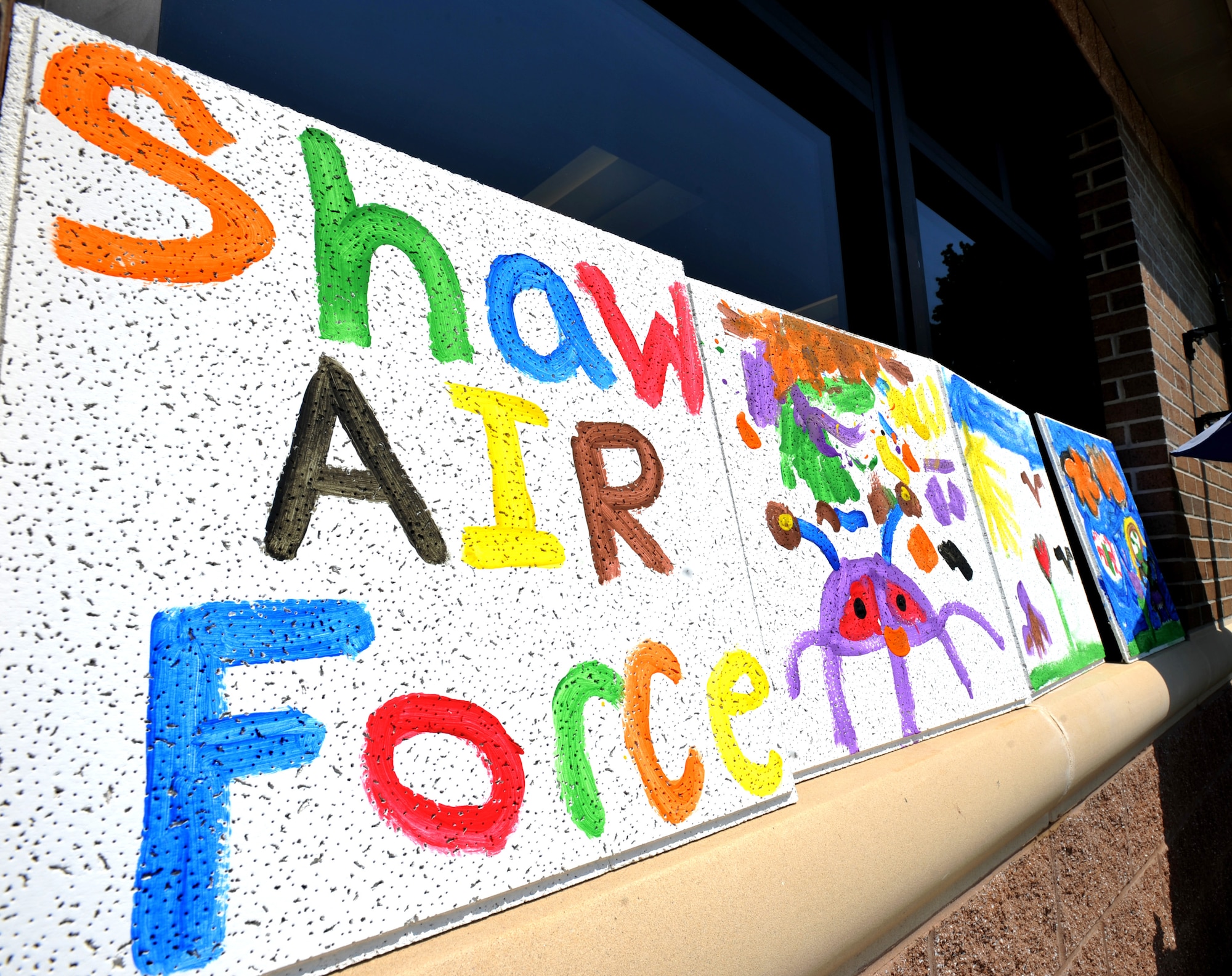 100621-F-4406D-024 SHAW AIR FORCE BASE, S.C.--    The "Children's World" tiles lay out to dry after the children finished painting them for the first activity to start the summer reading program at the McElveen Library June 21, 2010. The first day for registration and activity had a great turn out where eighty children registered. (U.S. Air Force photo/ Airman 1st Class Tabatha L. Duarte)