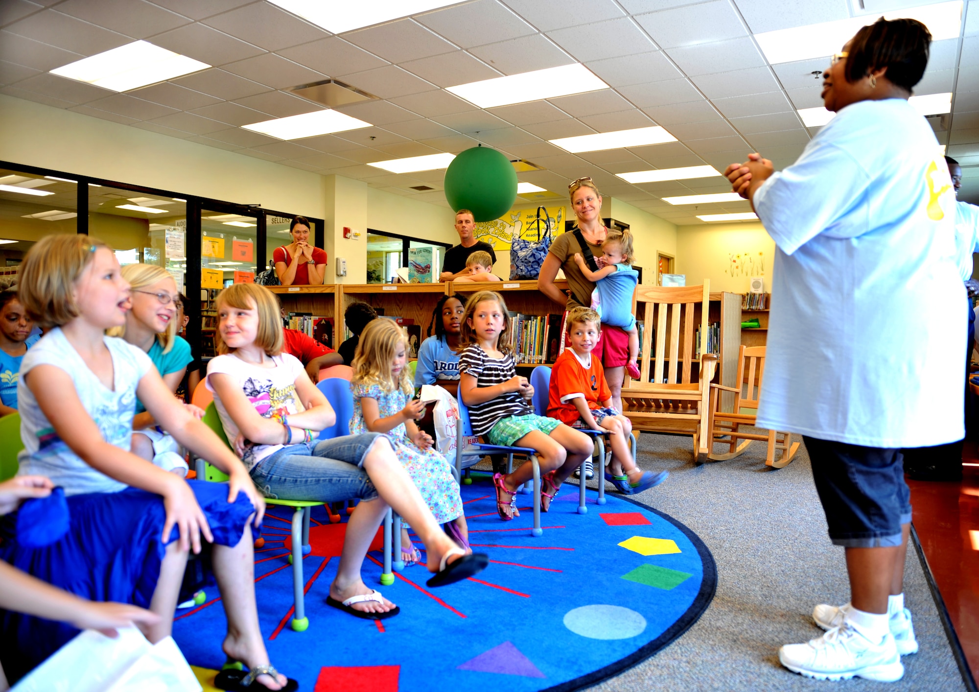 100621-F-4406D-011 SHAW AIR FORCE BASE, S.C.--    Tamara Collier, McElveen Library children's program coordinator, thanks the children for coming who registered for the summer reading program before releasing them to paint their ceiling tiles at the McElveen Library June 21, 2010.  Today was the official kick-off and registration day for the summer's reading program "Voyage to Book Island," in which a total of eighty children were registered.  (U.S. Air Force photo/ Airman 1st Class Tabatha L. Duarte)