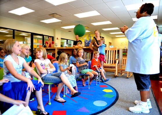 100621-F-4406D-011 SHAW AIR FORCE BASE, S.C.--    Tamara Collier, McElveen Library children's program coordinator, thanks the children for coming who registered for the summer reading program before releasing them to paint their ceiling tiles at the McElveen Library June 21, 2010.  Today was the official kick-off and registration day for the summer's reading program "Voyage to Book Island," in which a total of eighty children were registered.  (U.S. Air Force photo/ Airman 1st Class Tabatha L. Duarte)
