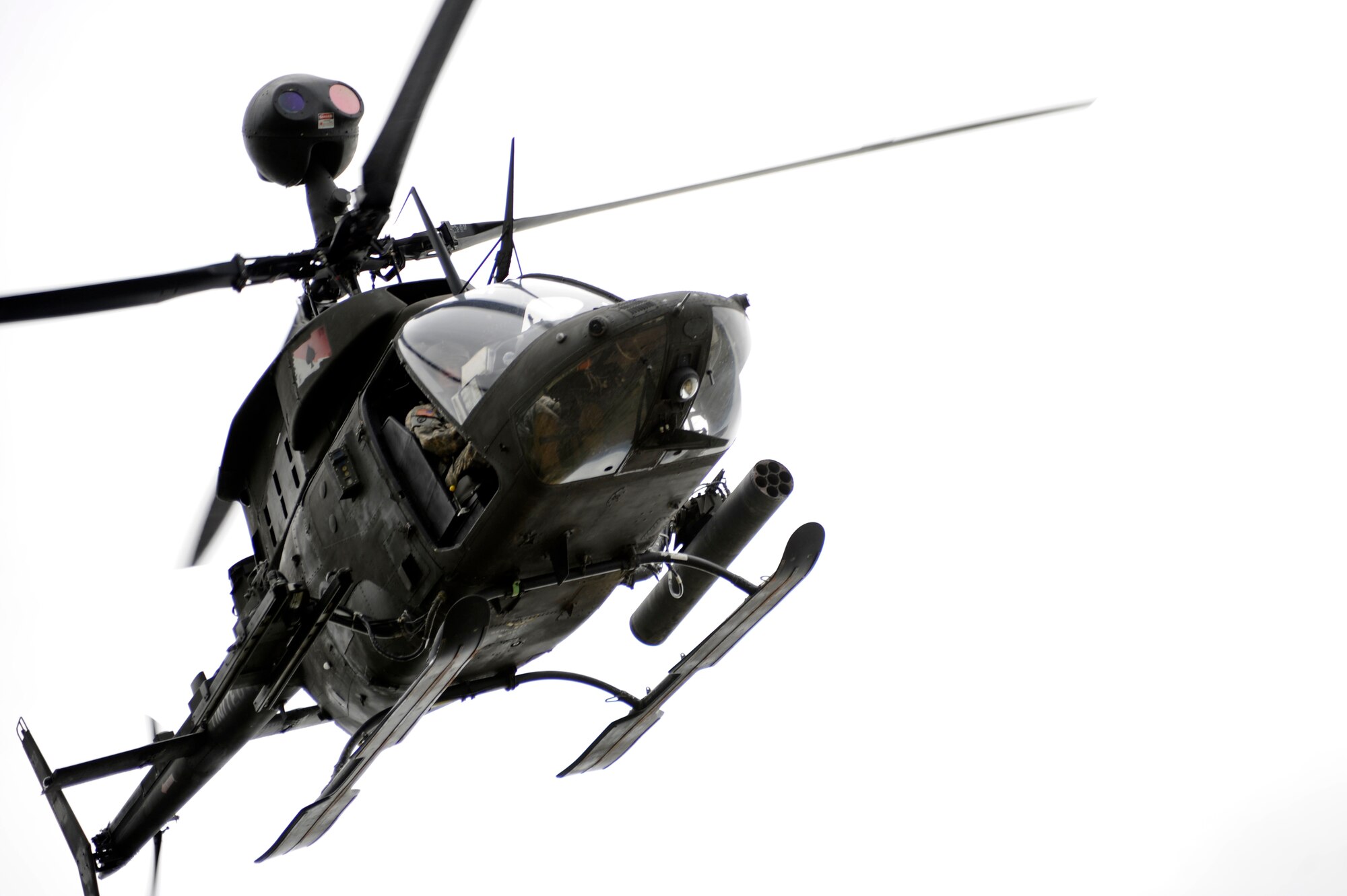 An OH-58 Kiowa flies over head June 17, 2010, Eielson Air Force Base, Alaska. The Kiowa is responsible for observation, utility, and direct fire support, like in this mock extraction of Japanese Air Self Defense Force personnel. The soldiers are assigned to Ft. Wainwright, Alaska. (U.S. Air Force photo/ Willard E. Grande II)