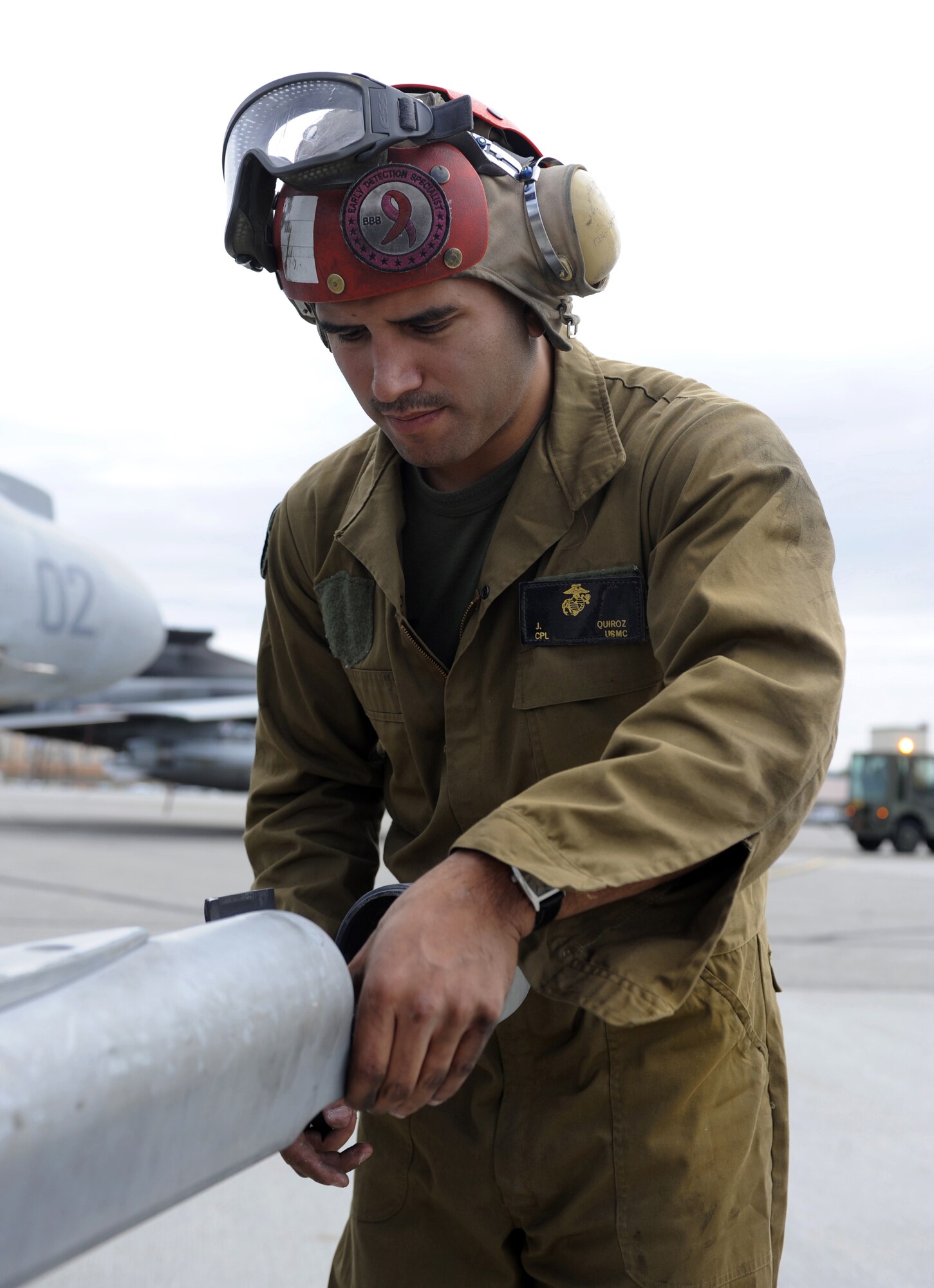 Marine Corps Cpl. Joseph Quiroz conducts a routine inspection June 15, 2010, Eielson Air Force Base, Alaska. Corporal Quiroz does walk around checks to ensure ordinance is safe for flight. Corporal Quiroz is an ordnance technician assigned to VMA-214. (U.S. Air Force photo/Airman 1st Class Willard E. Grande II)