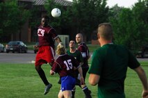MINOT AIR FORCE BASE, N.D. -- A 91st Operations Group intramural soccer team member head butts the ball during their game versus the 5th Civil Engineer Squadron team here June 15. The 5th CES team defeats the 91st OG team 4-2. Different squadrons on Minot Air Force Base participate in intramural soccer matches at the field in front of the McAdoo Sports and Fitness Center as a way of increasing unit cohesiveness and boosting base morale. (U.S. Air Force photo by Airman 1st Class Aaron-Forrest Wainwright)