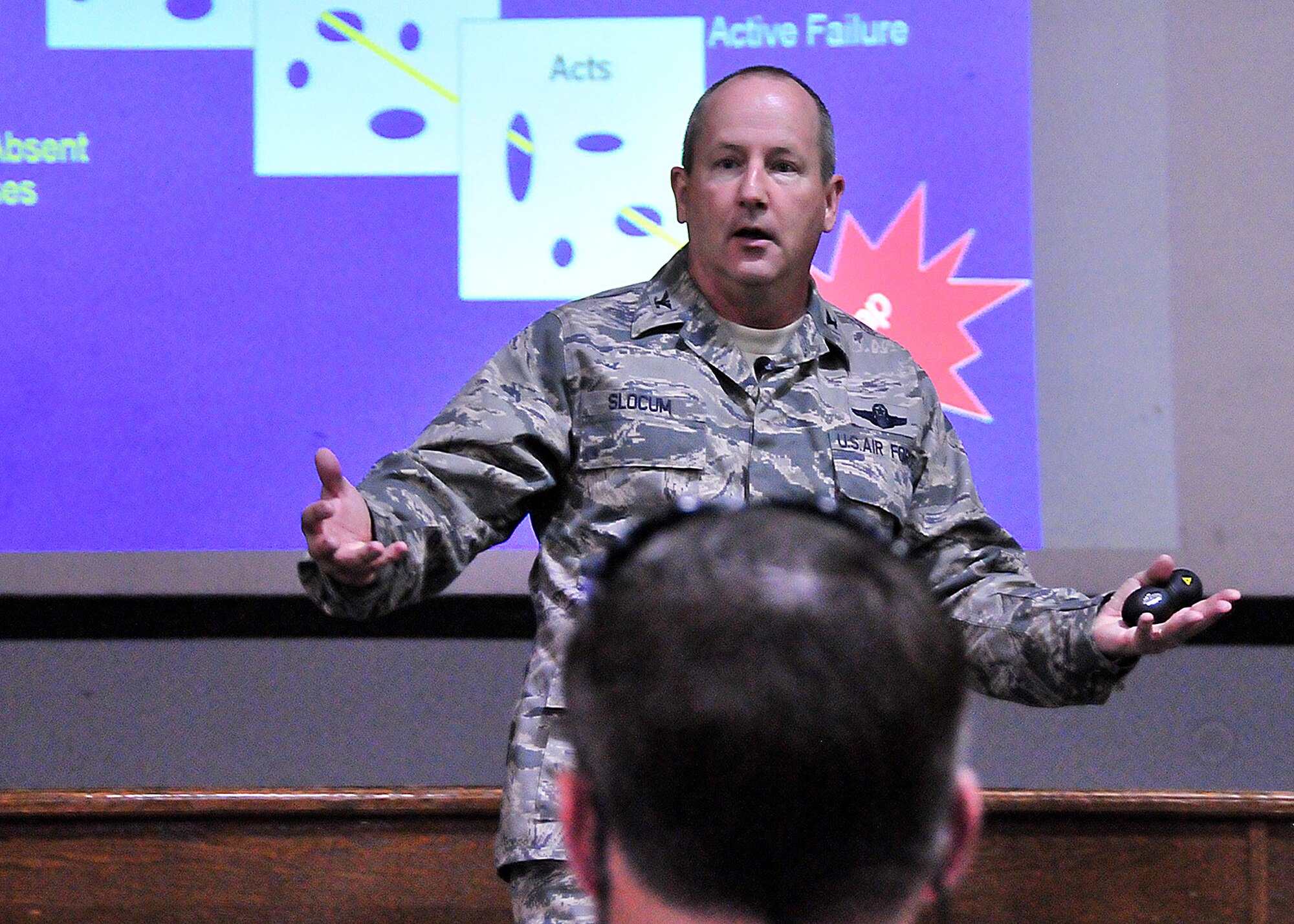 Col. John Slocum, the Air National Guard's safety director, discusses high-risk behavior, suicides and Wingman concepts with Airmen from the Air Guard Readiness Center at the base theatre on Joint Base Andrews, Md., during an Air Force-wide Wingman Stand-down June 9, 2010.