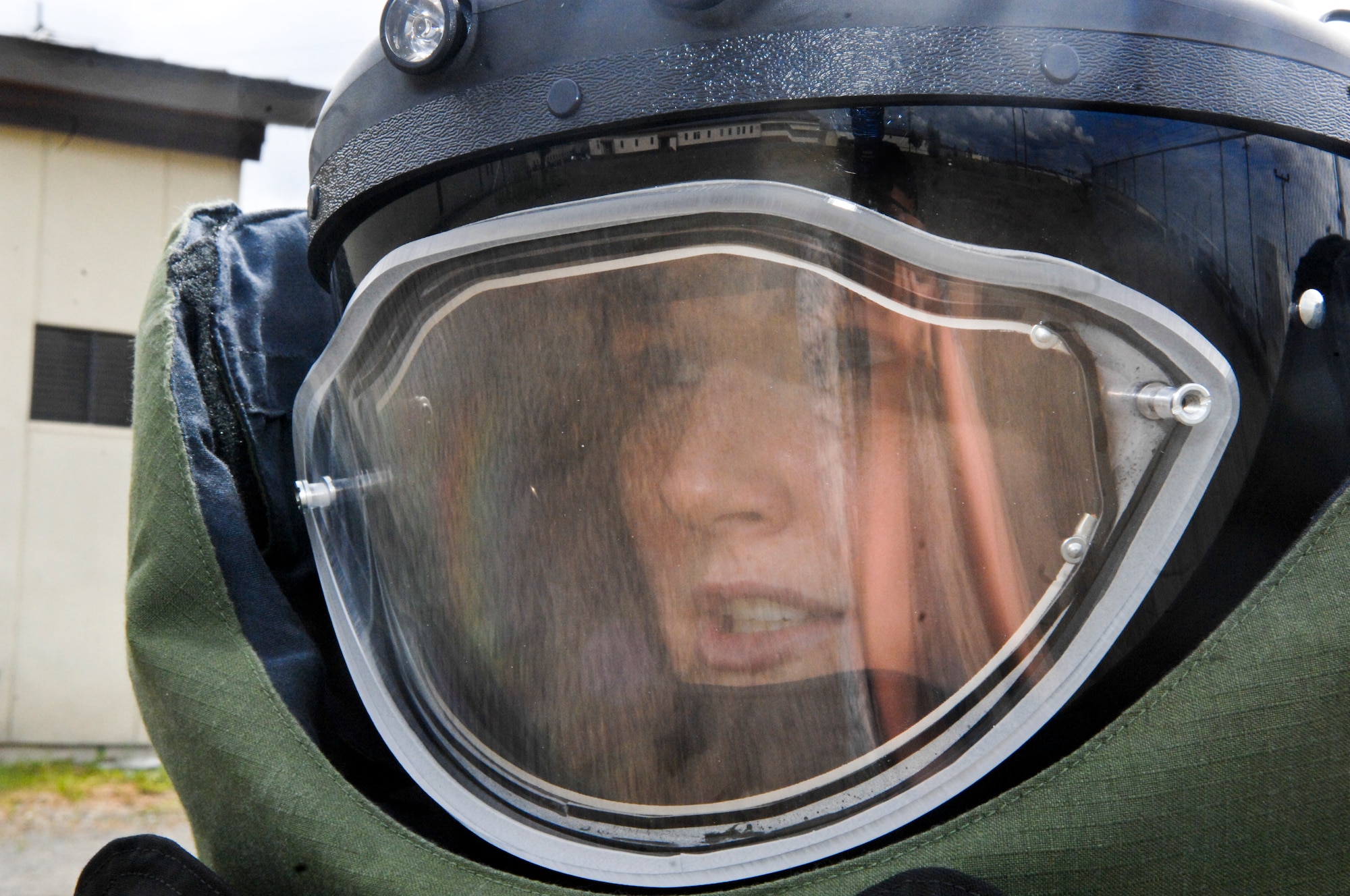 Airman 1st Class Monica Benzien, 3rd Civil Engineer Squadron explosive ordinance disposal journeyman, mentally prepares herself before attempting to move a 75-pound simulated explosive during a training exercise, June 17. EOD members train weekly on proper disposal of ordinance. (Air Force photo by Airman 1st Class Jack Sanders)
