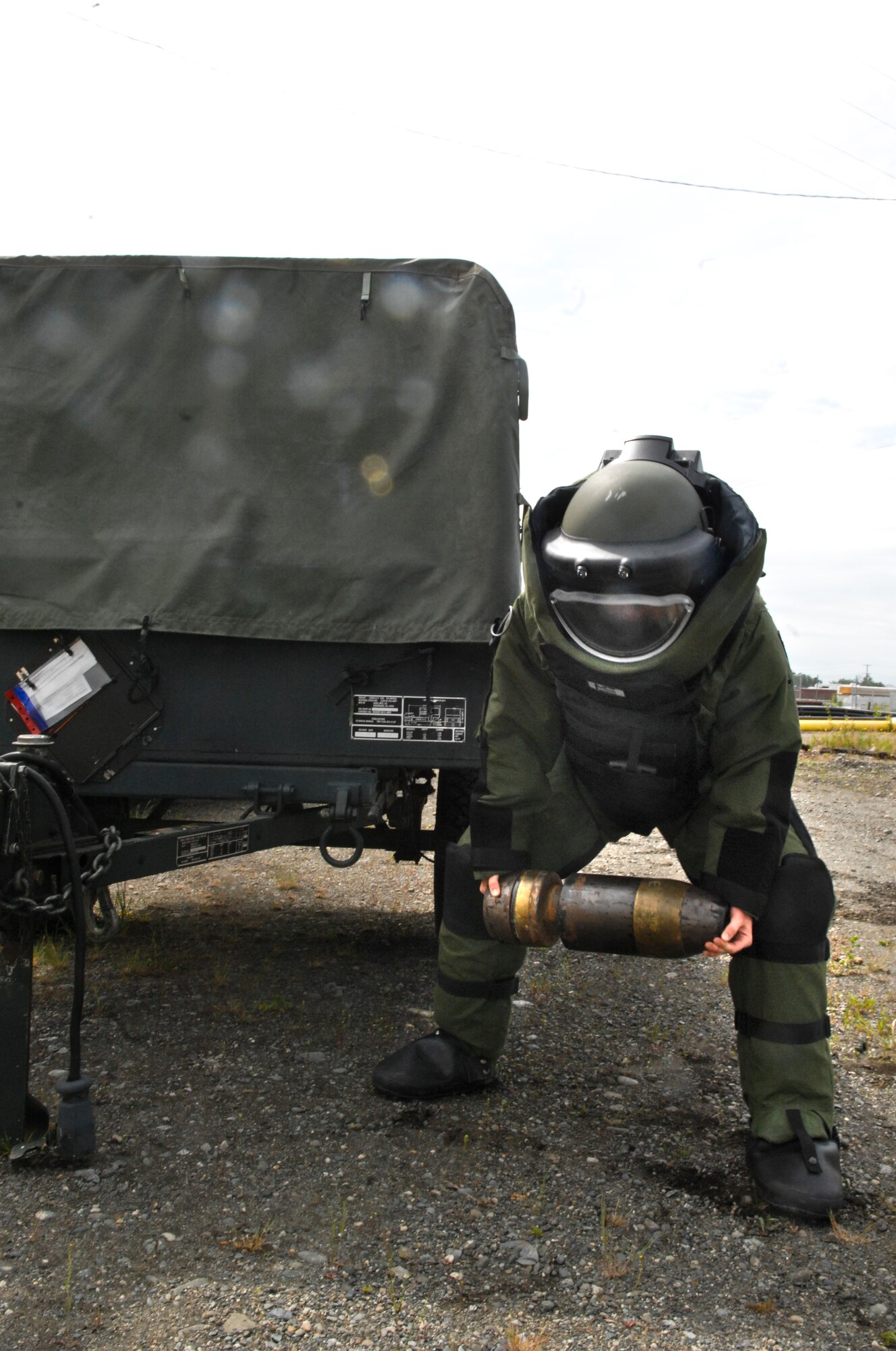 Airman 1st Class Monica Benzien, 3rd Civil Engineer Squadron explosive ordinance disposal journeyman, lifts a 75-pound simulated explosive during a training exercise, June 17. EOD members train weekly on proper disposal of ordinance. (Air Force photo by Airman 1st Class Jack Sanders)