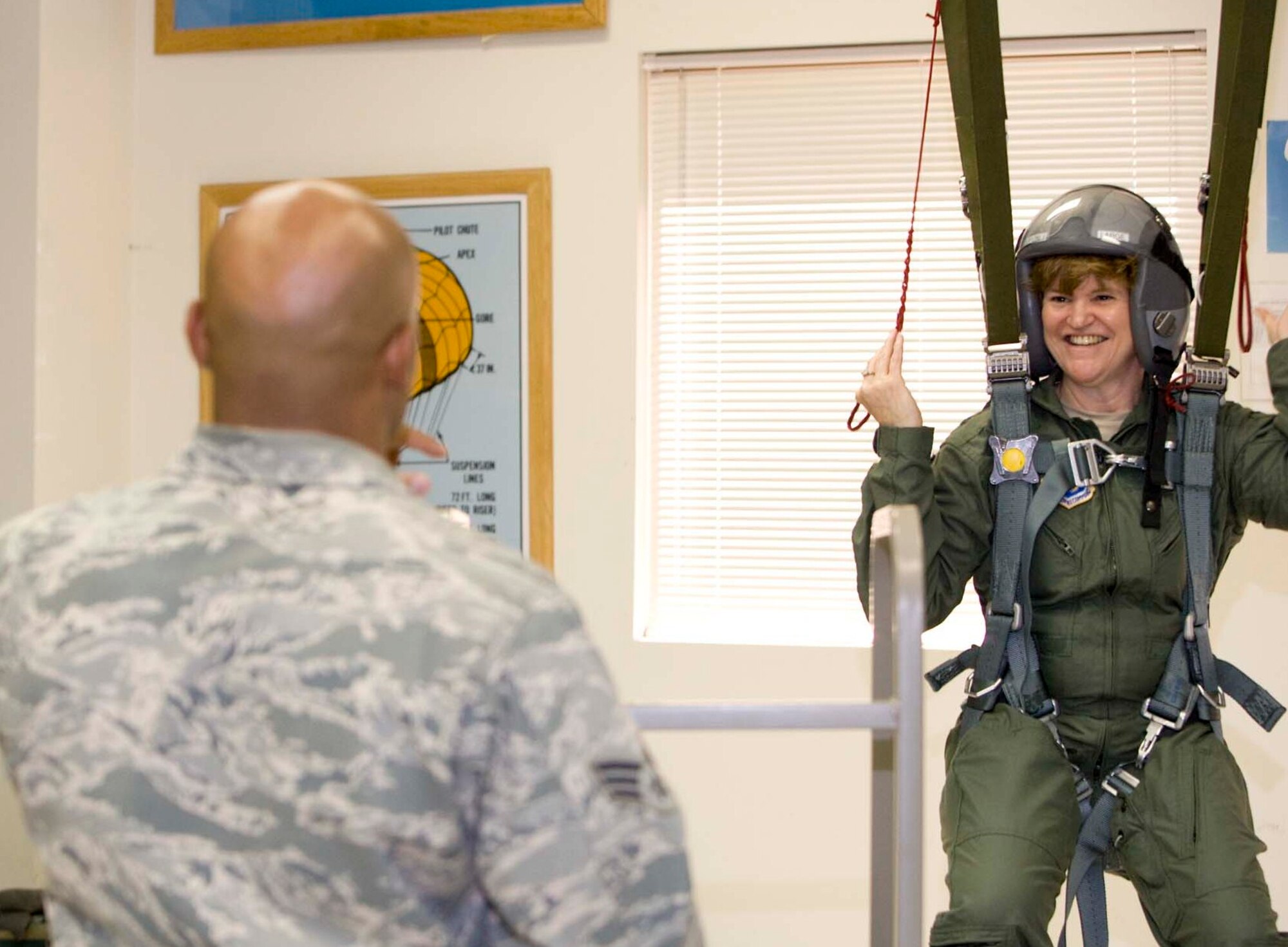 Lt. Gen. Janet C. Wolfenbarger, Air Force Materiel Command vice commander,  receives instructions on controlling a parachute with four-line steering.  General Wolfenbarger visited Edwards June 15-18 to attend the U.S. Air Force Test Pilot School Senior Executive Short Course and to meet with base leadership.  (Air Force photo by Chad Bellay)  