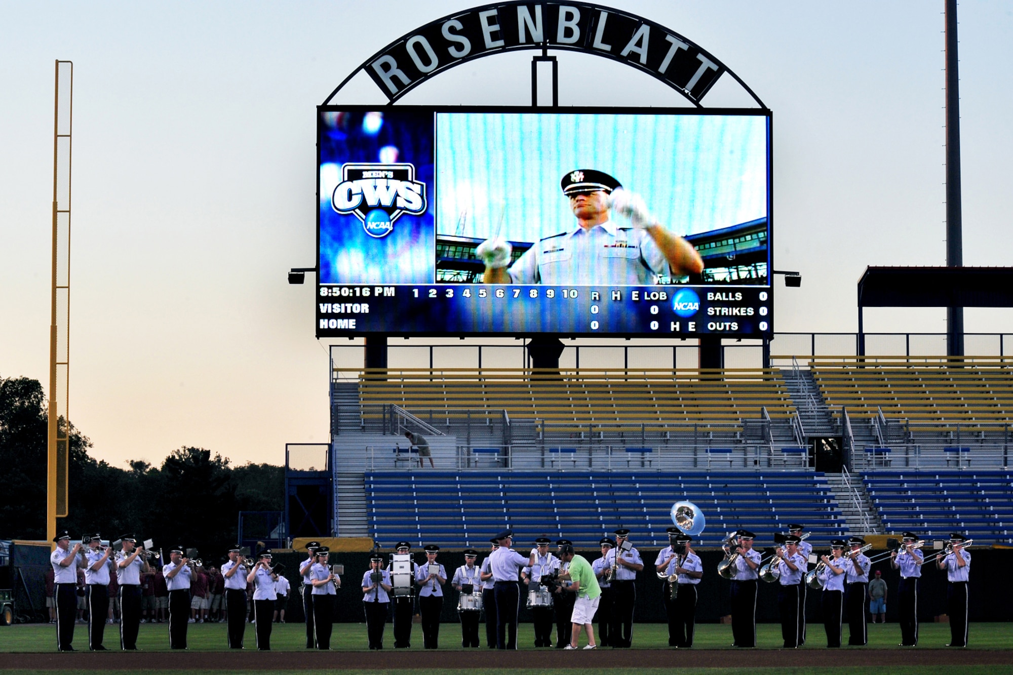 OFFUTT AIR FORCE BASE, Neb. - First Lieutenant Michael Hoerber, commander with the Air Combat Command Heartland of America Band, conducts the band through various songs during the opening ceremony of the College World Series at the Rosenblatt Stadium in Omaha, Neb., June 18. This is the last year the College World Series will be held at Rosenblatt Stadium as a new stadium is currently under construction. 

U.S. Air Force Photo by charles haymond