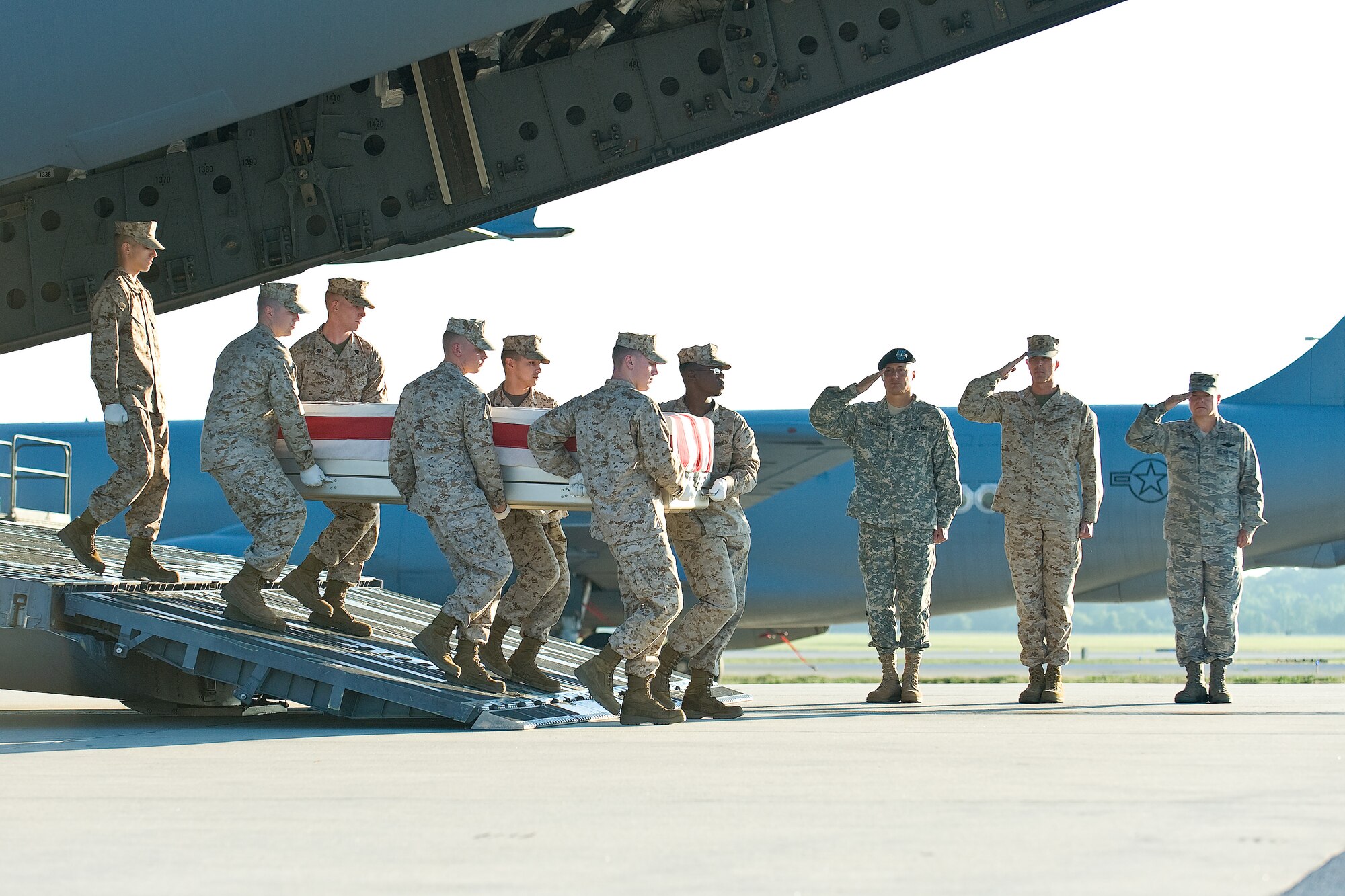 A U.S. Marine Corps team transfers the remains of Marine Corps Lance Cpl. Michael C. Bailey, of Park Hills, Mo., at Dover Air Force Base, Del., June 18. Lance Cpl. Bailey was assigned to 3rd Battalion, 7th Marine Regiment, 1st Marine Division, I Marine Expeditionary Force, Marine Corps Air Ground Combat Center, based at Twentynine Palms, Calif. (U.S. Air Force photo/Roland Balik)
