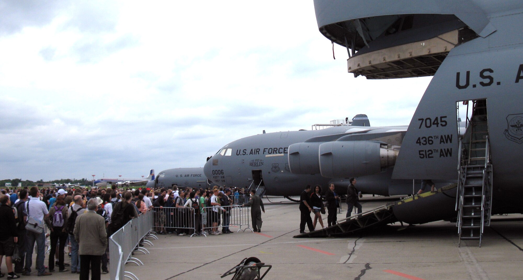 BERLIN- Visitors wait in line to take a tour of the C-5 Galaxy displayed during the International Aerospace Exhibition 2010 Berlin Air Show held on the Berlin-Schonefeld Airport here, June 8 - 13. Ten C-5 Galaxy aircrew members from the 512th and 436th Airlift Wings, Dover Air Force Base, Del., composed the crew that ushered the enormous aircraft to the 100-year old air show. (U.S. Air Force/submitted photo)                         