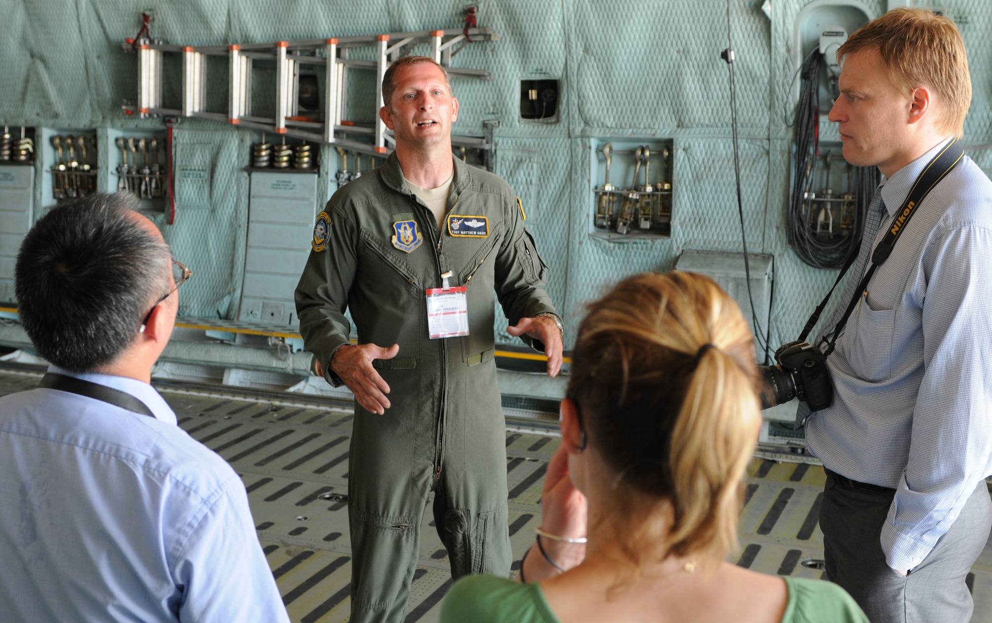 BERLIN- Tech. Sgt. Matthew Harr, 709th Airlift Squadron loadmaster, explains the function of the C-5 Galaxy during a tour at the International Aerospace Exhibition 2010 Berlin Air Show held on the Berlin-Schonefeld Airport here, June 12. Ten Airmen from the 512th and 436th Airlift Wings, Dover Air Force Base, Del., composed the aircrew that accompanied the giant aircraft to the show. (U.S. Air Force photo/submitted photo)
