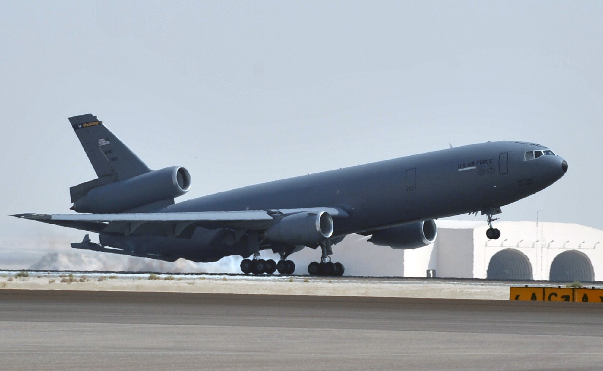 A flight crew from the 908th Expeditionary Air Refueling Squadron brings a KC-10 Extender in for a landing June 7, 2010, after completing a combat mission in the U.S. Central Command area of responsibility. The 908th EARS, as part of the 380th Air Expeditionary Wing, supports operations Iraqi Freedom, Enduring Freedom, and the Combined Joint Task Force-Horn of Africa. (U.S. Air Force Photo/Master Sgt. Scott T. Sturkol/Released)