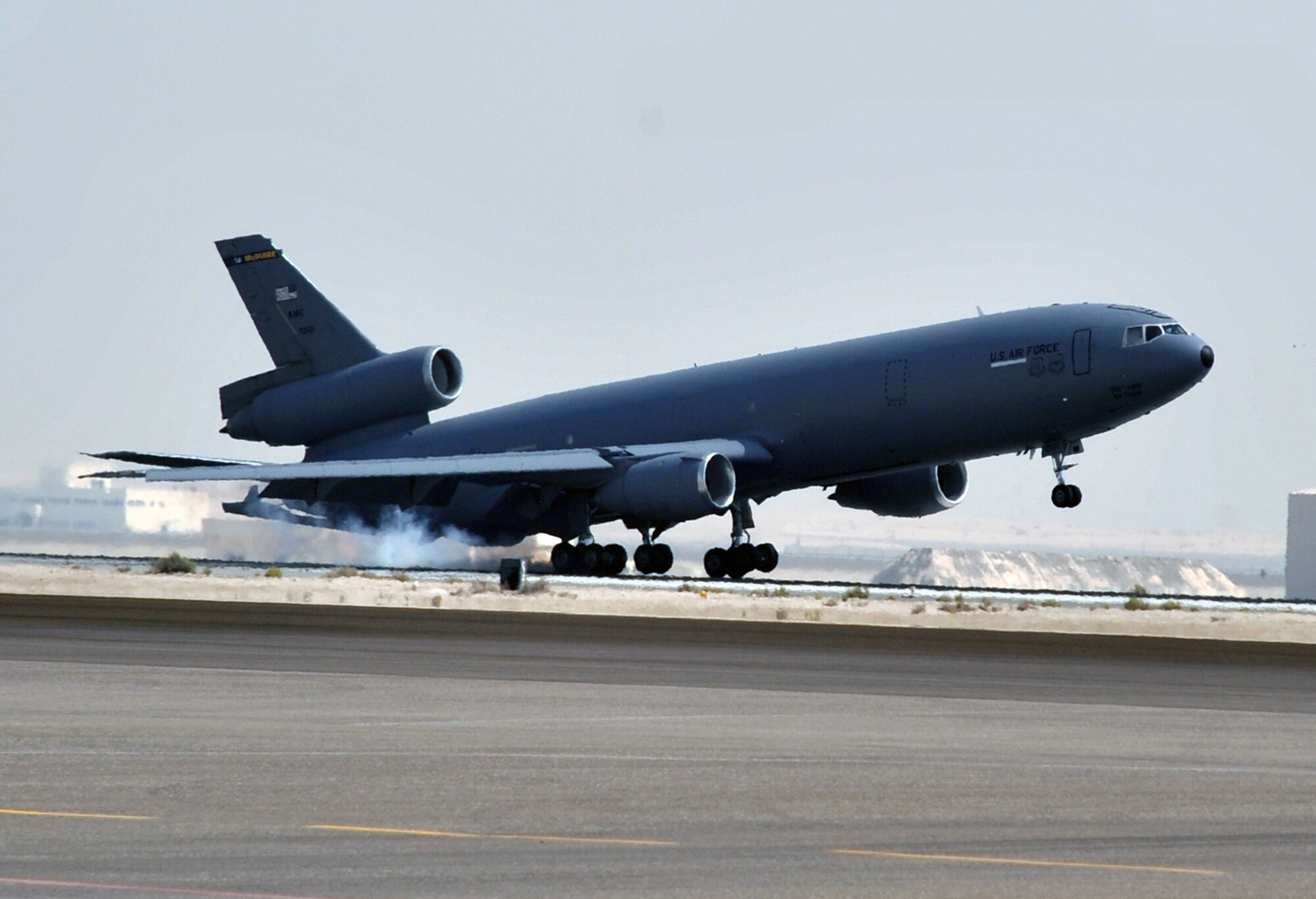A flight crew from the 908th Expeditionary Air Refueling Squadron brings a KC-10 Extender in for a landing June 7, 2010, after completing a combat mission in the U.S. Central Command area of responsibility. The 908th EARS, as part of the 380th Air Expeditionary Wing, supports operations Iraqi Freedom, Enduring Freedom, and the Combined Joint Task Force-Horn of Africa. (U.S. Air Force Photo/Master Sgt. Scott T. Sturkol/Released)