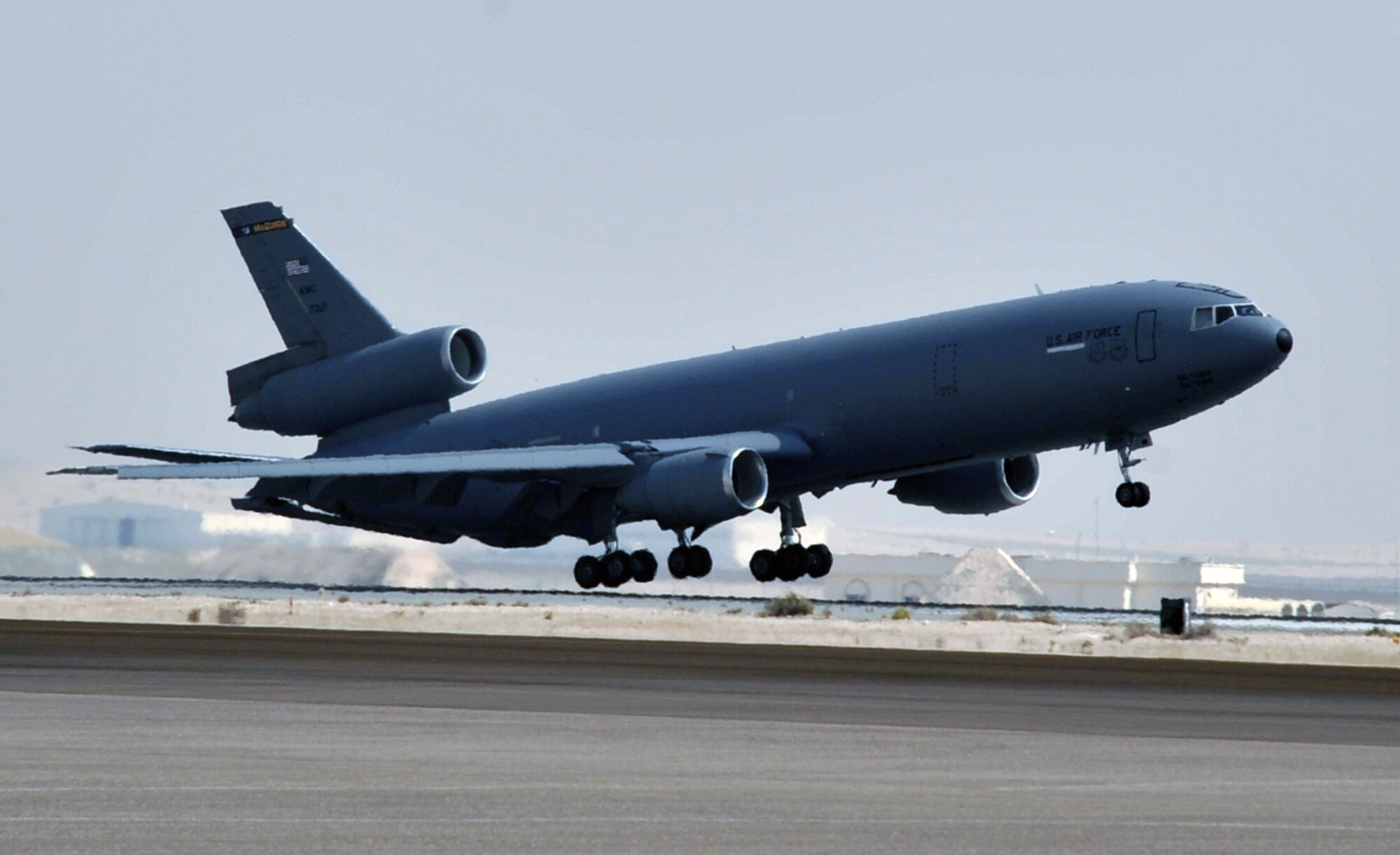 A flight crew from the 908th Expeditionary Air Refueling Squadron brings a KC-10 Extender in for a landing June 7, 2010, after completing a combat mission in the U.S. Central Command area of responsibility. The 908th EARS, as part of the 380th Air Expeditionary Wing, supports operations Iraqi Freedom, Enduring Freedom, and the Combined Joint Task Force-Horn of Africa. (U.S. Air Force Photo/Master Sgt. Scott T. Sturkol/Released)